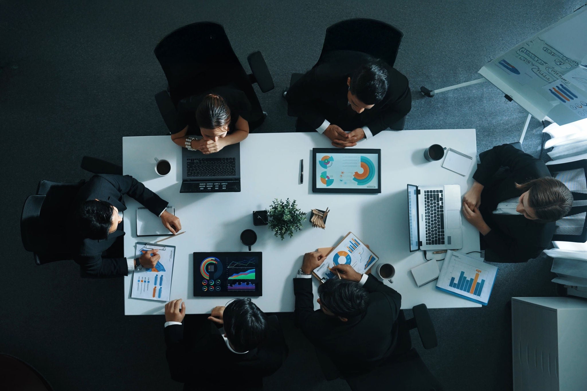 Top view of executive manager presenting growth graph