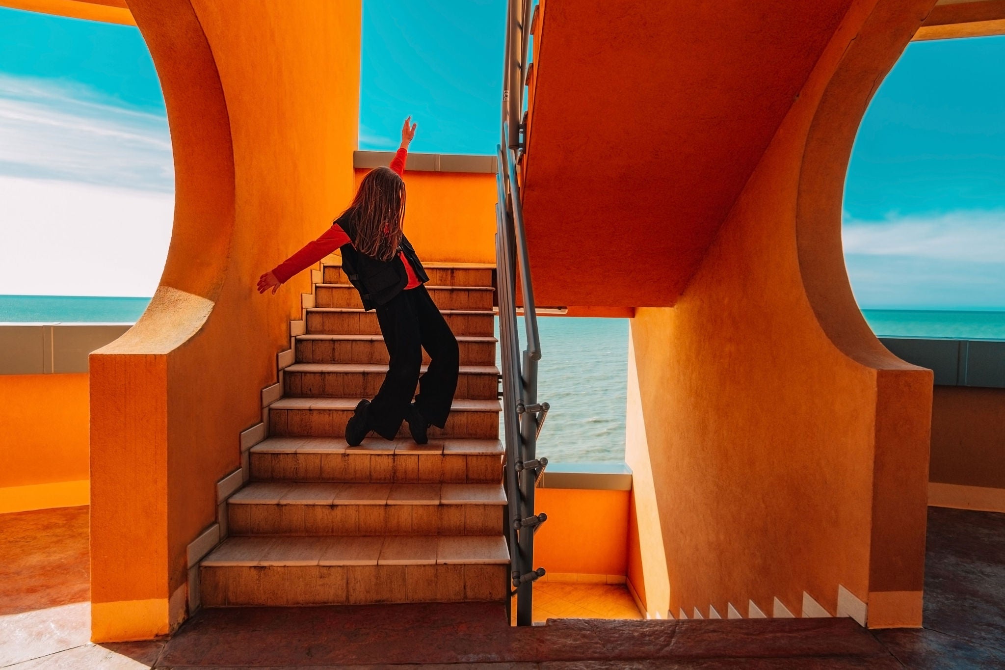 teenager dancing on the stairs