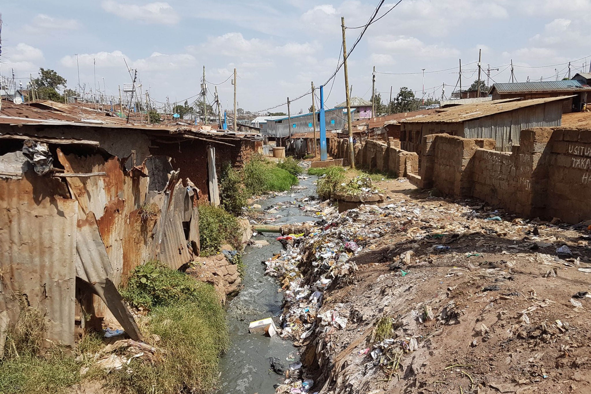 Shanty town polluted stream