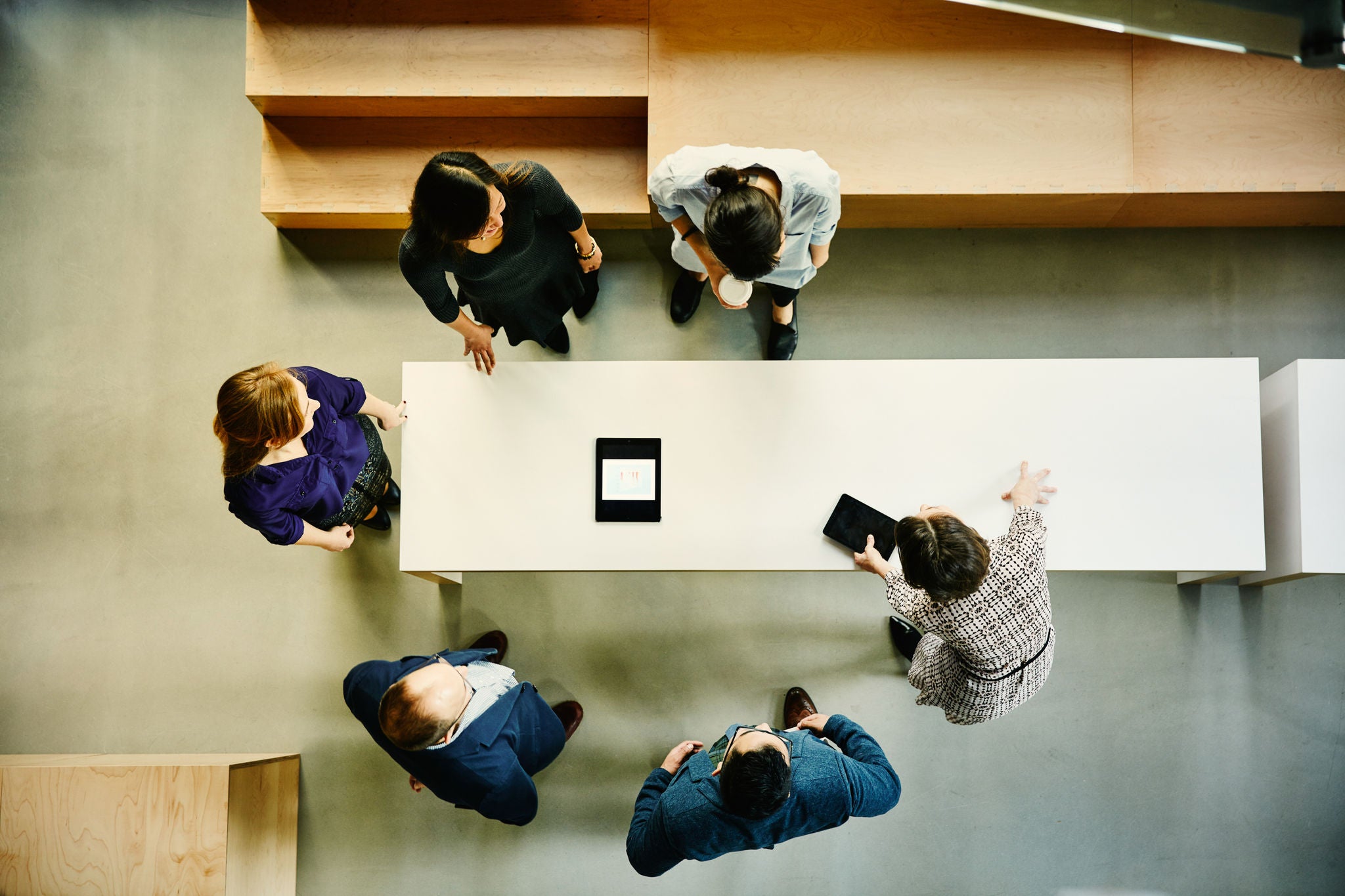 Overhead view of businesswoman leading meeting