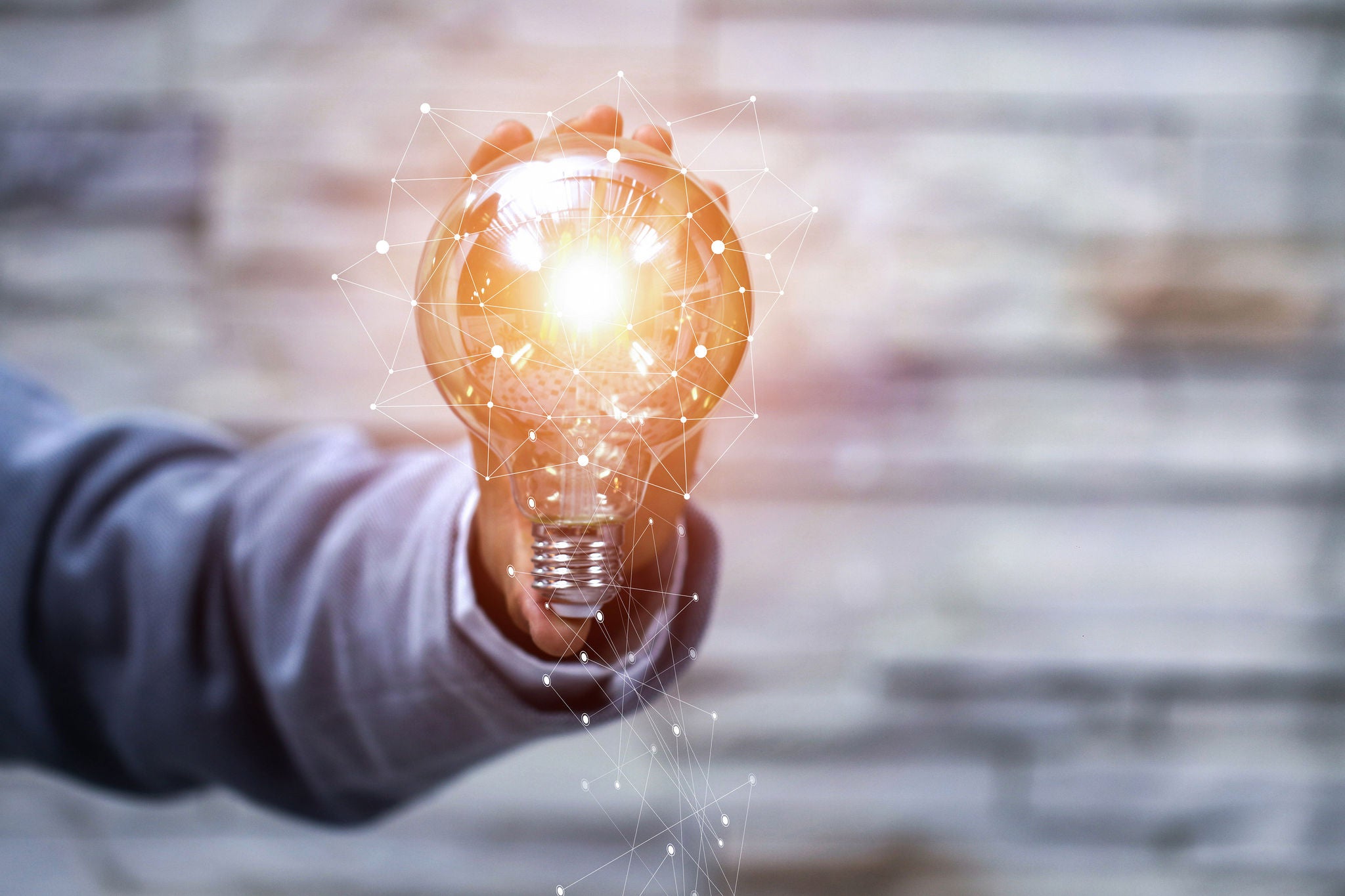 man holding light bulb