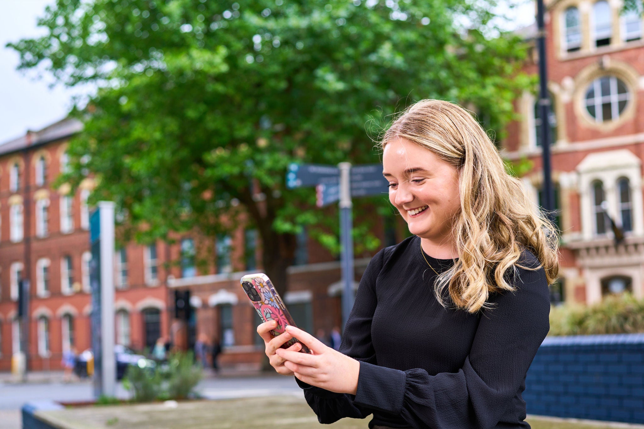 Person using their phone outside