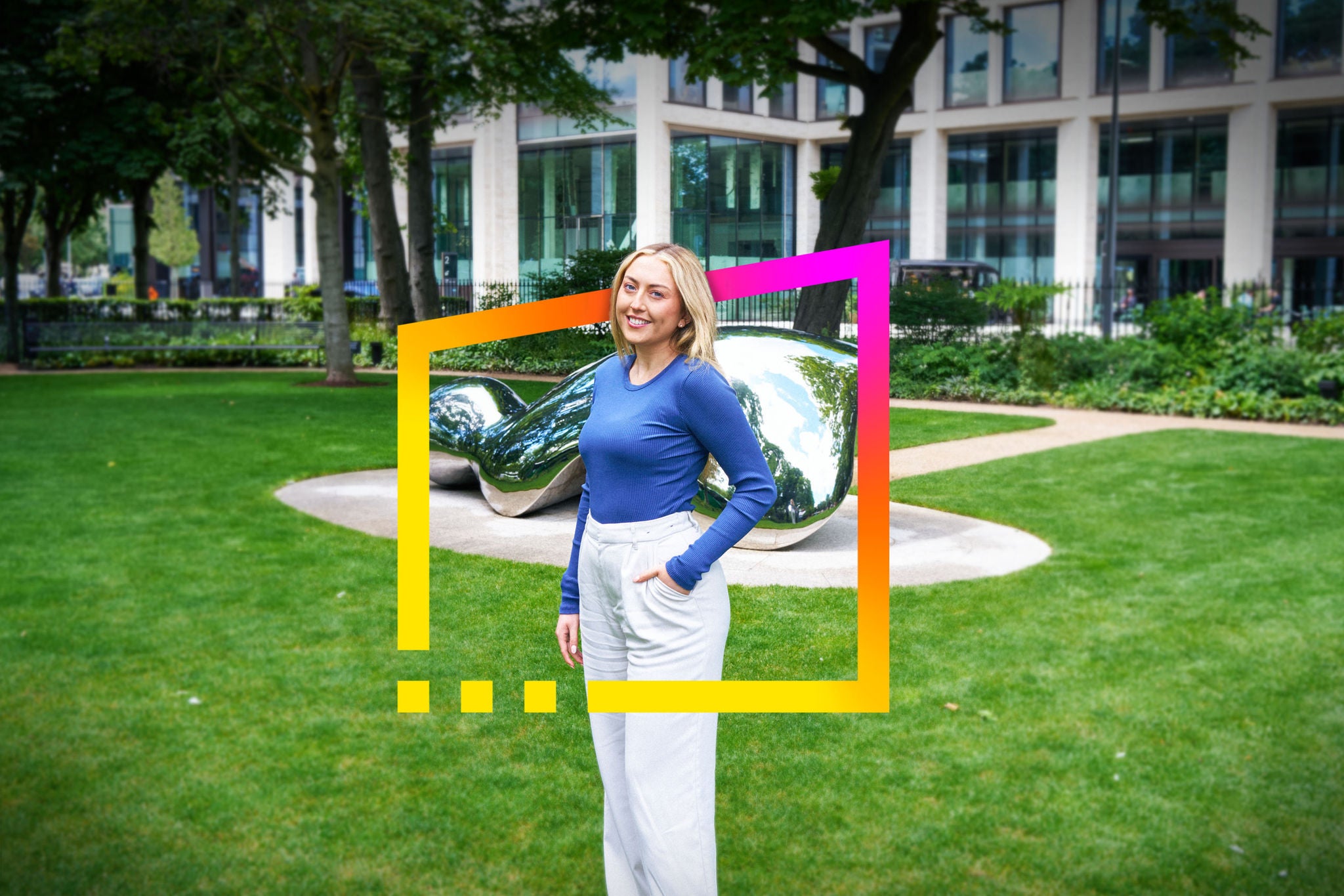 Hannah standing in a landscaped business park with EY brand frame graphic