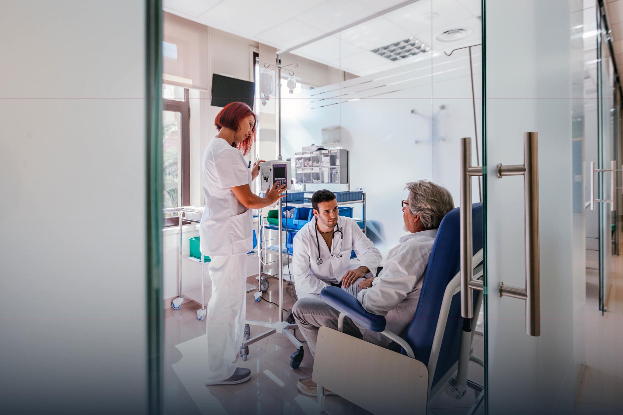 medical treatment room with three people