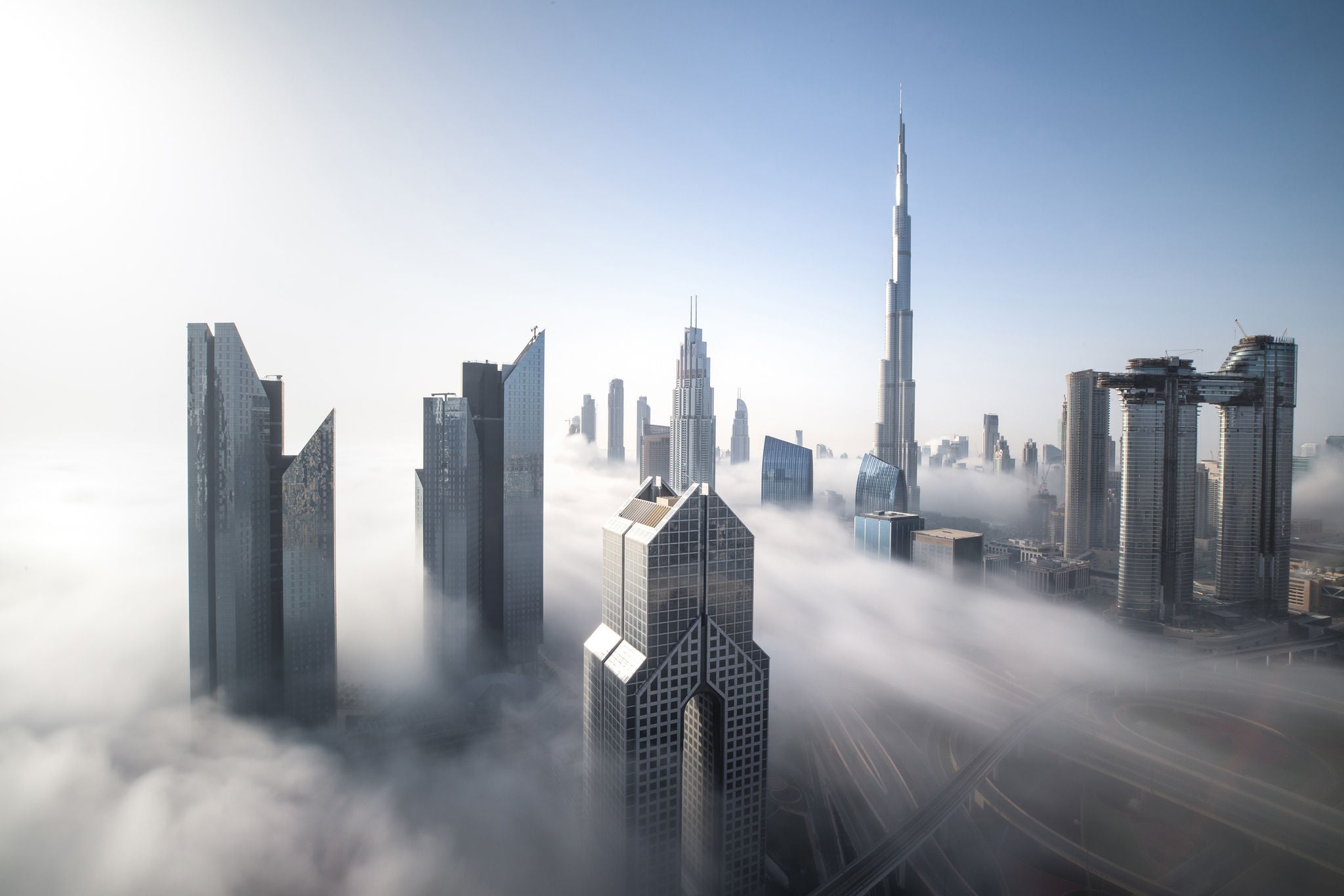 View of downtown Dubai with fog surrounding the skyscrapers.