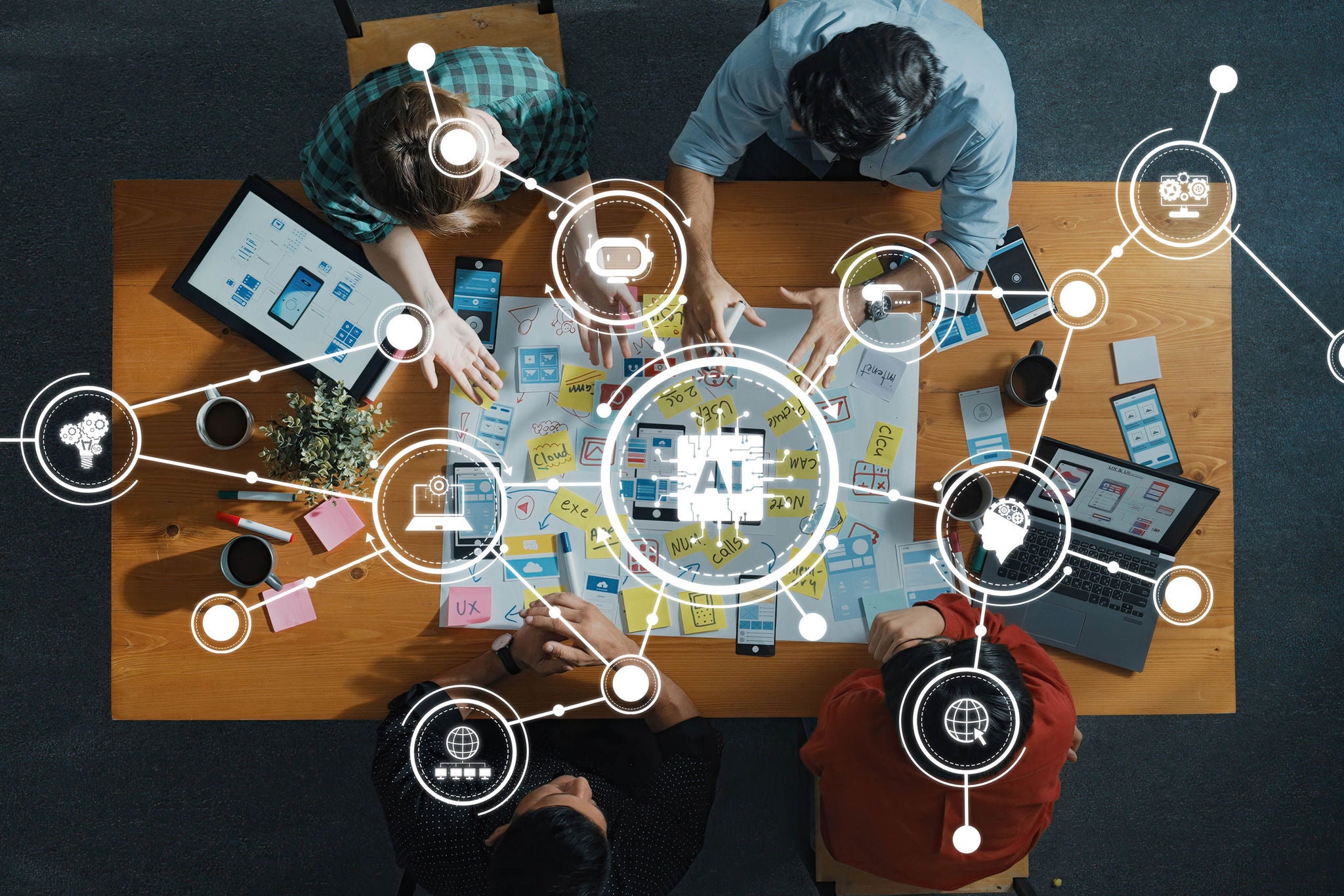 Team som utvecklar AI-lösningar med digitala verktyg vid ett träbord och visar innovation och kreativitet.