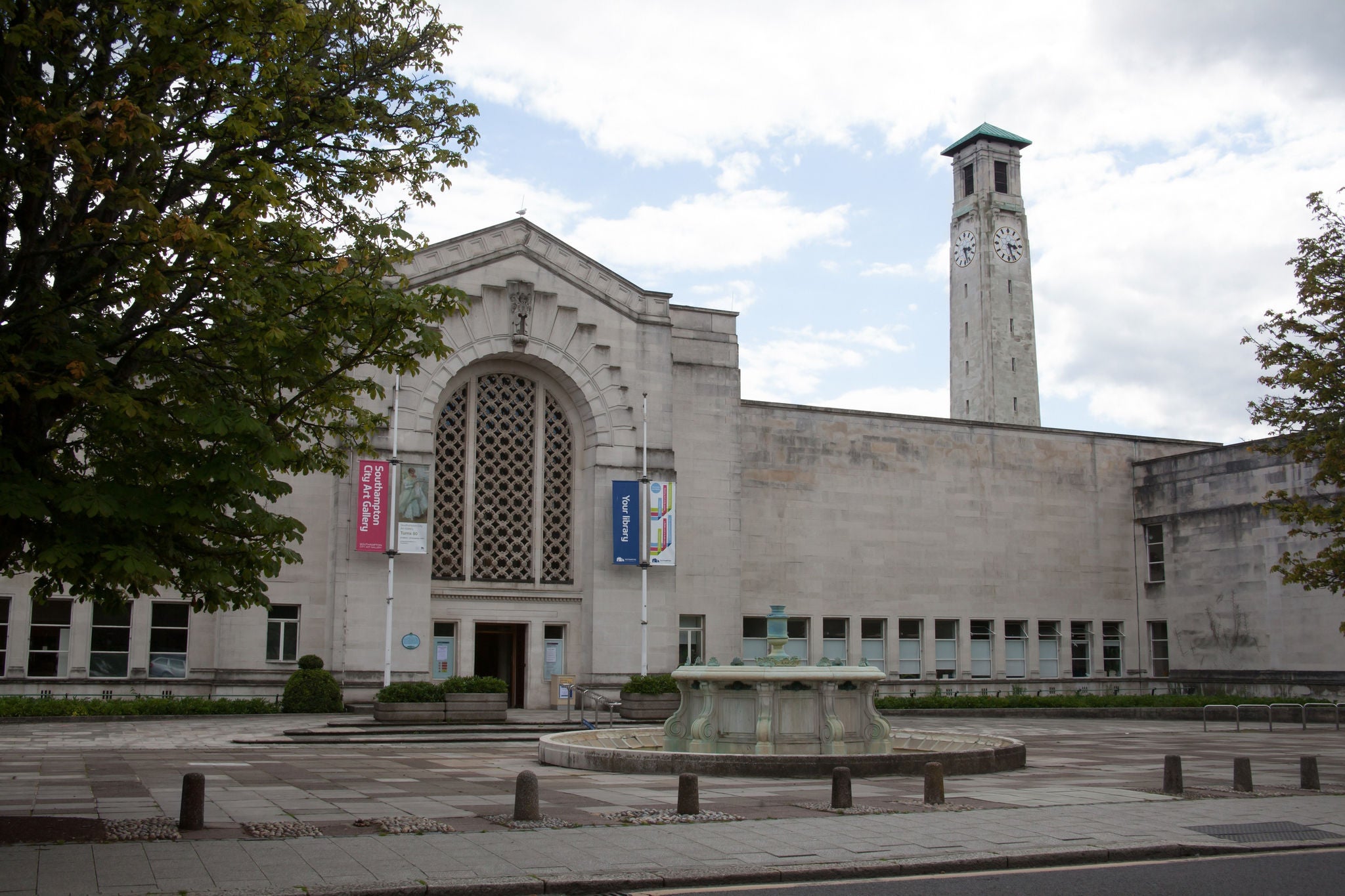 Stone art gallery building with clock tower in Southampton