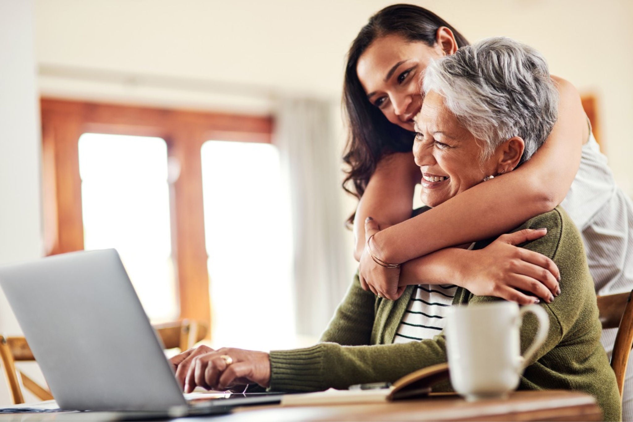 Person using laptop at home with family