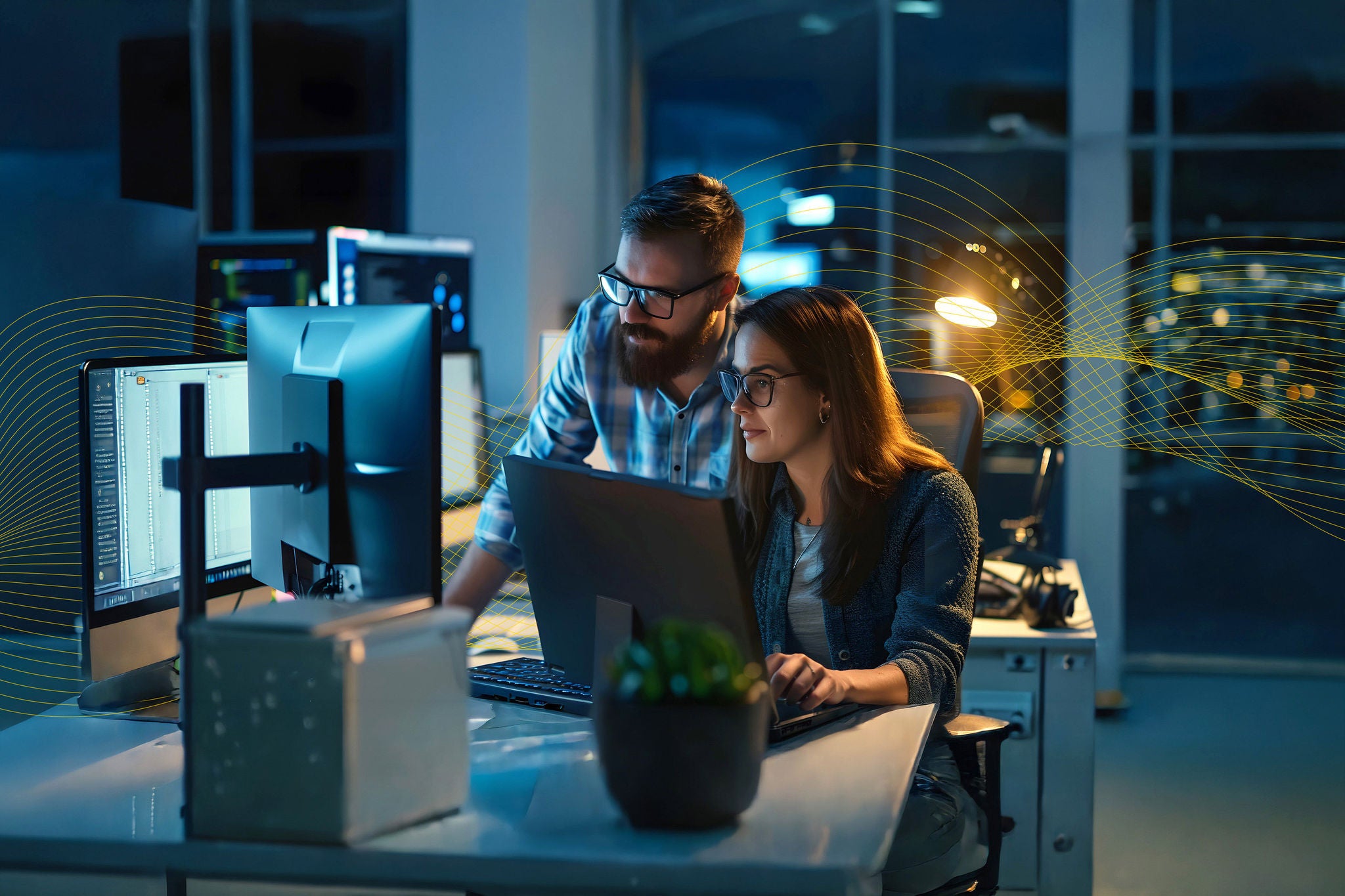 professional security researchers; computer screen; office desk; collaboration; cybersecurity; analysis