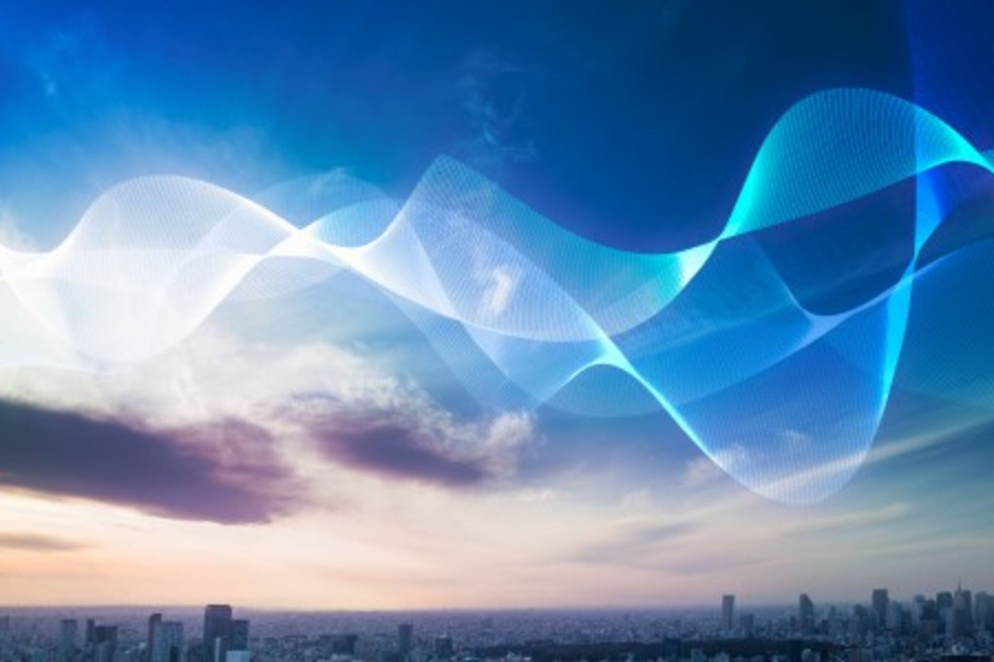 Abstract blue wave over city skyline.