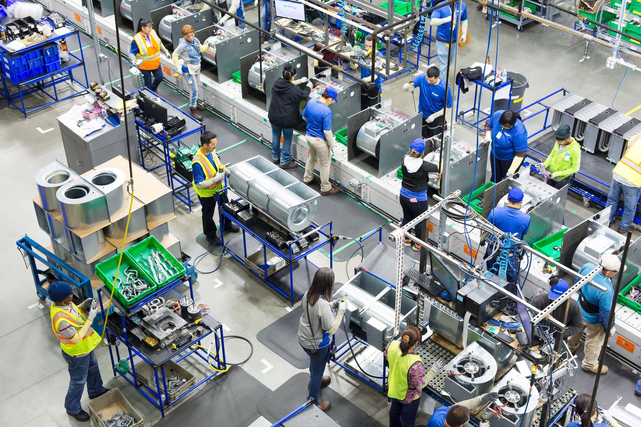 Workers inside the Daikin plant in Waller Texas