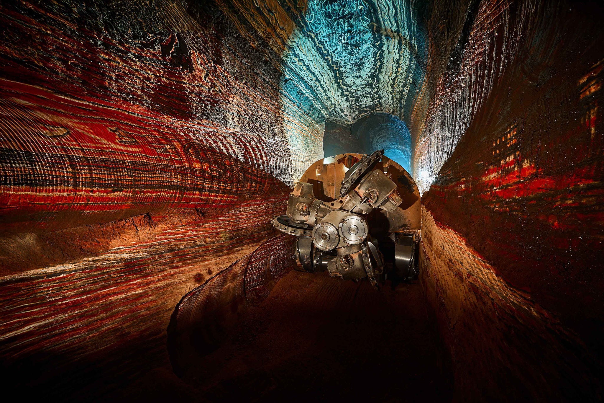 Mining drilling machine in tunnel of sylvinite salt quarry. Equipment for mineral ore digging in pit. Organic materials for fertilizers