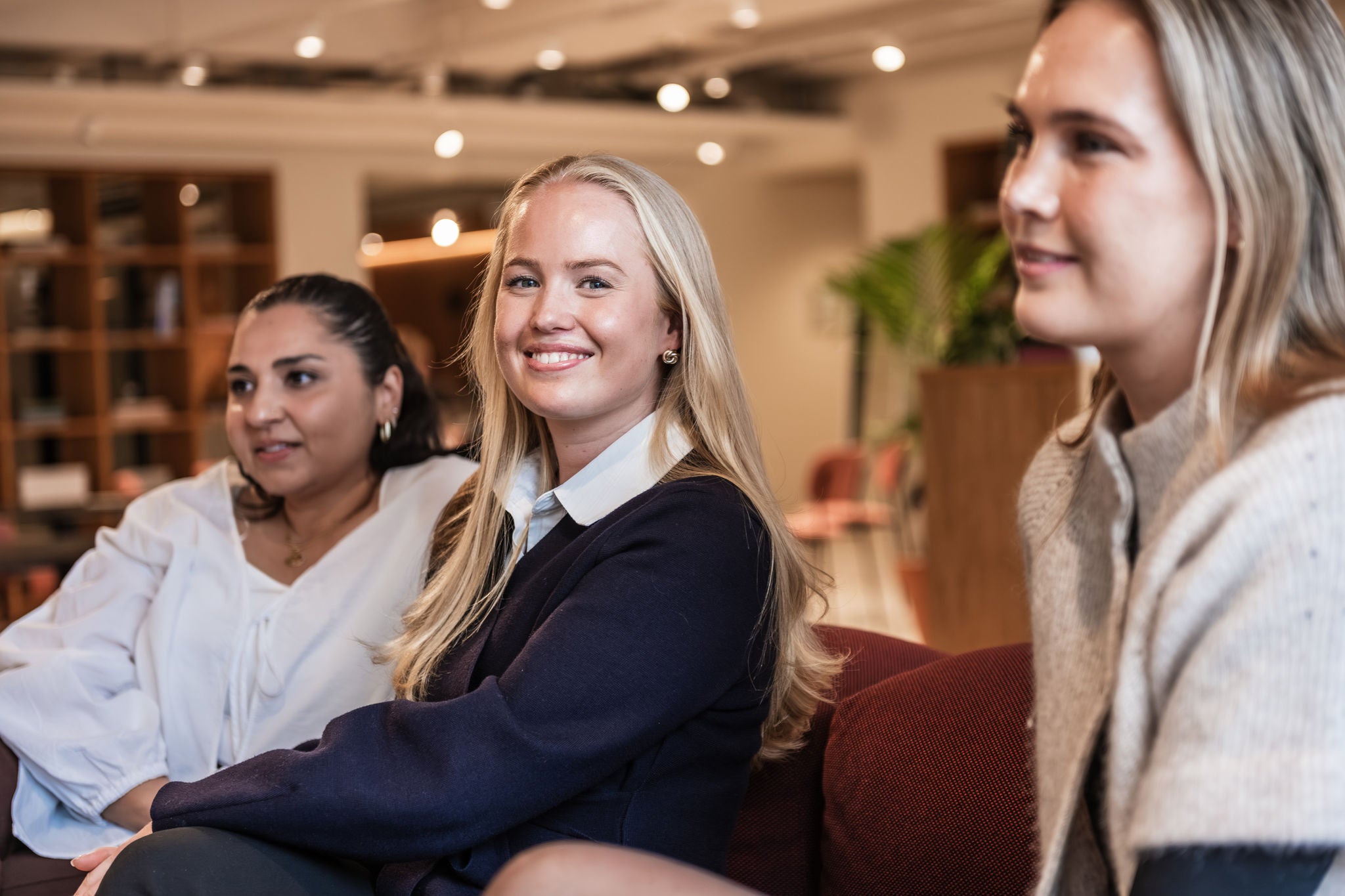 Consulting professionals collaborating during an informal office meeting