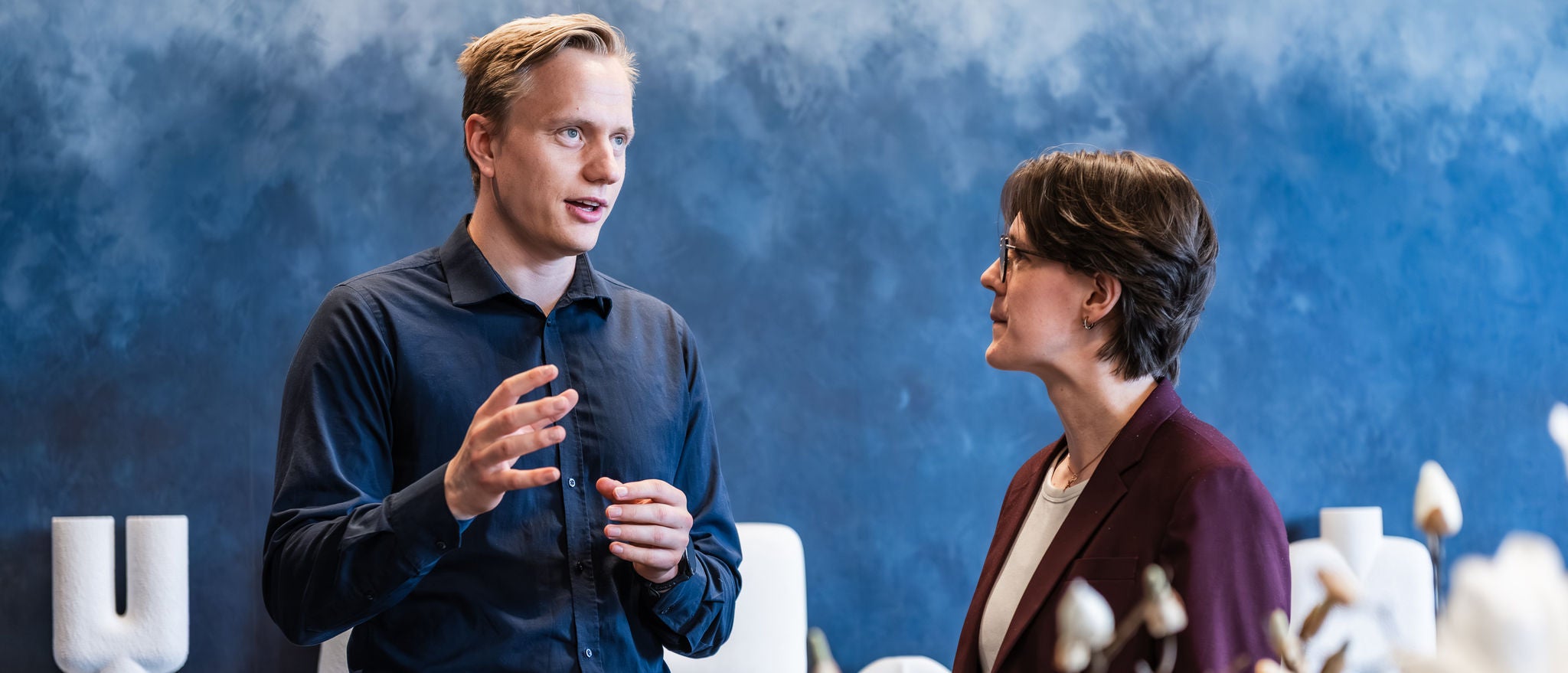 Experienced professionals exchanging insights during a workplace discussion