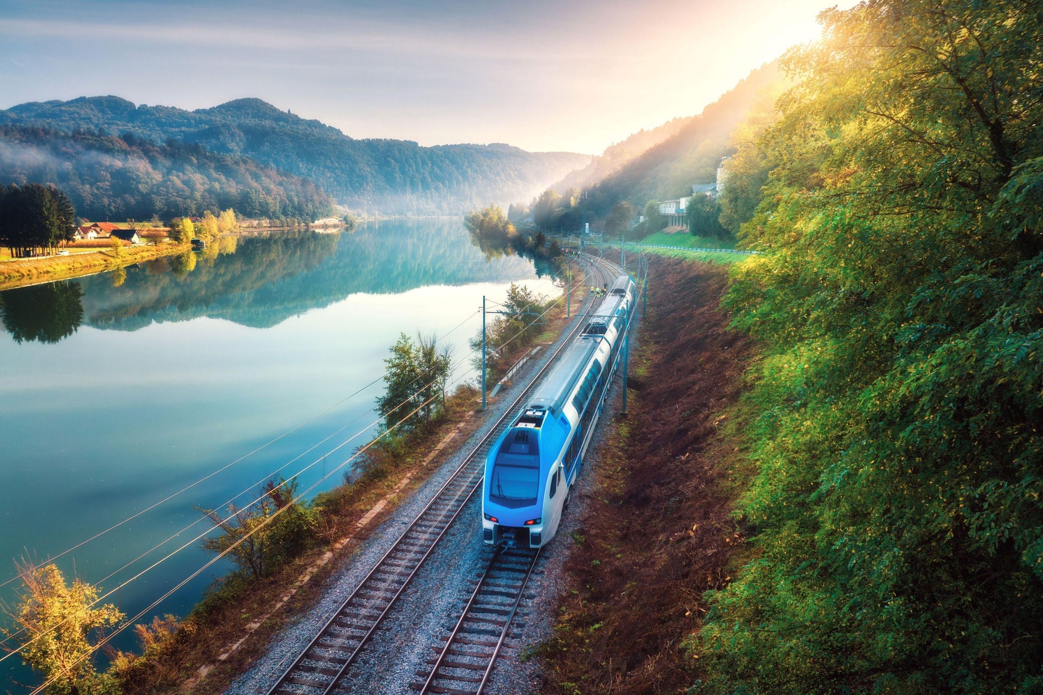 Train passing by a river