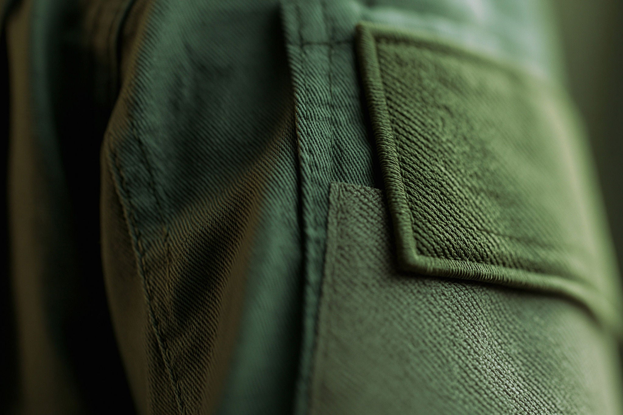 Close up image of the arm of a green jacket