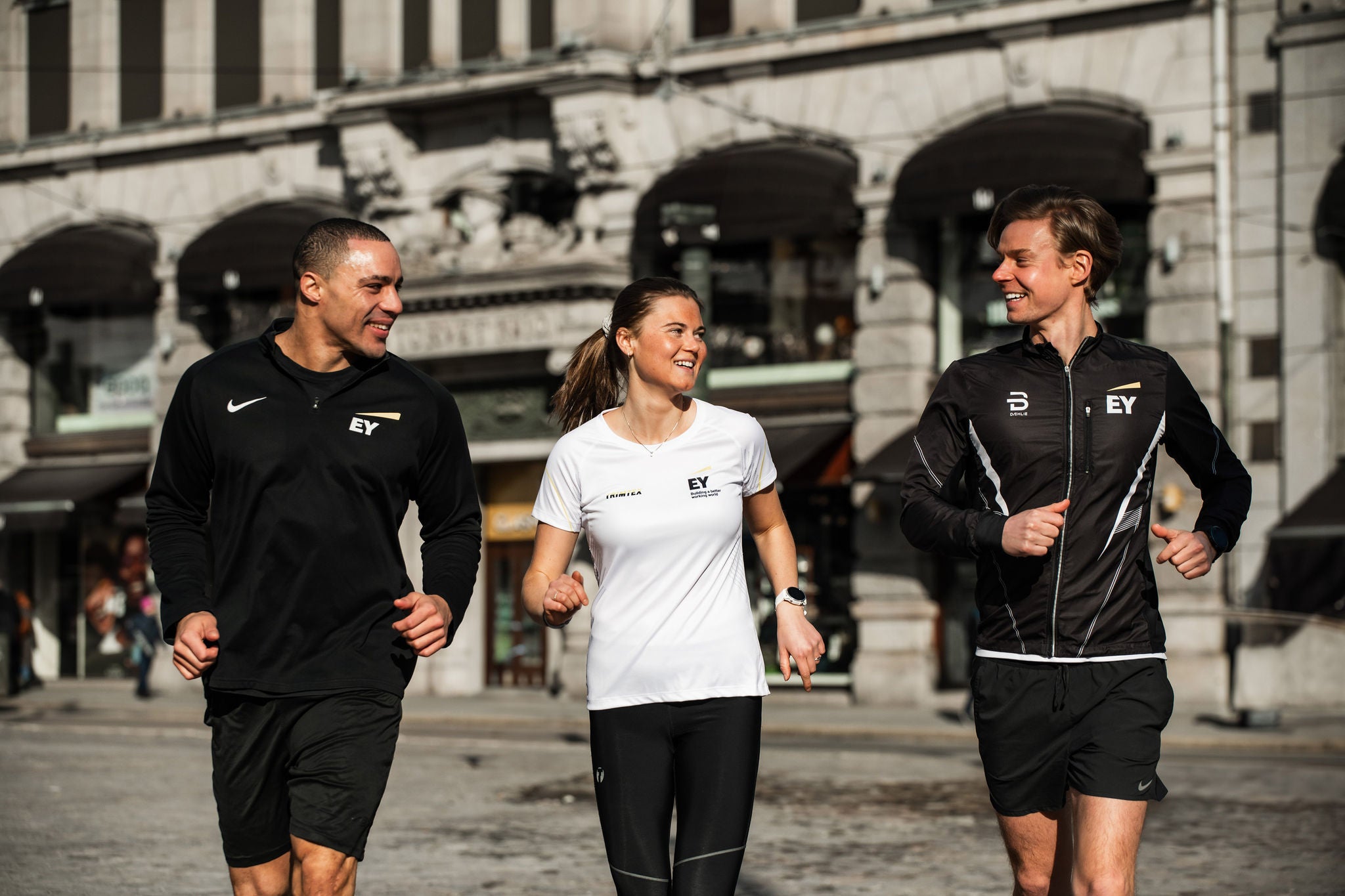 Employees participating in a workplace run through the city.