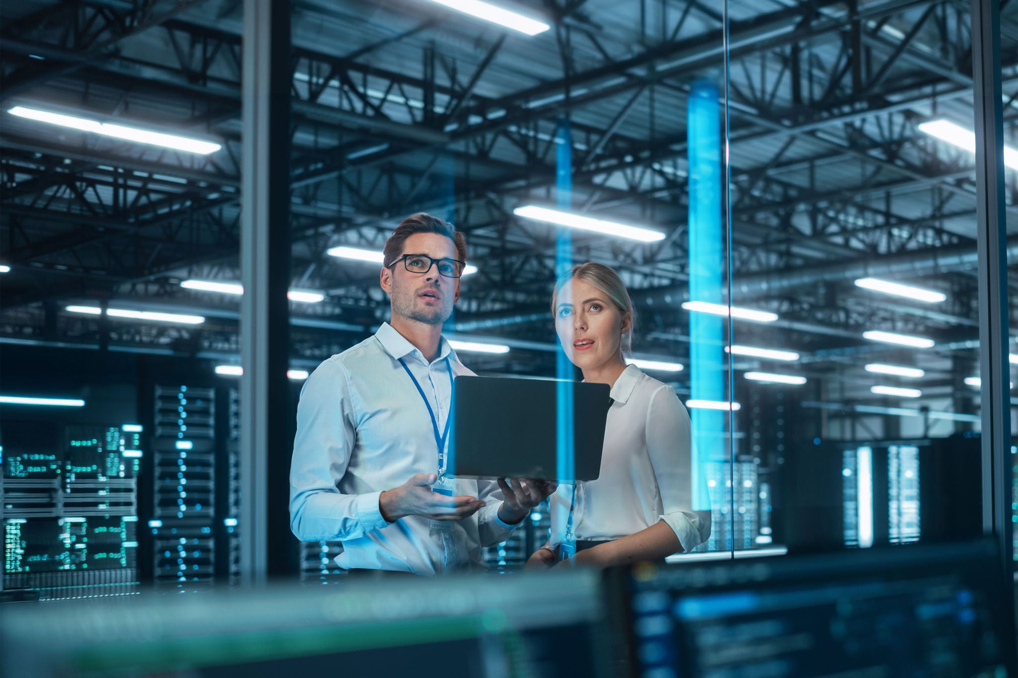 Male and Female Business Partners Brainstorming Cloud Infrastructure