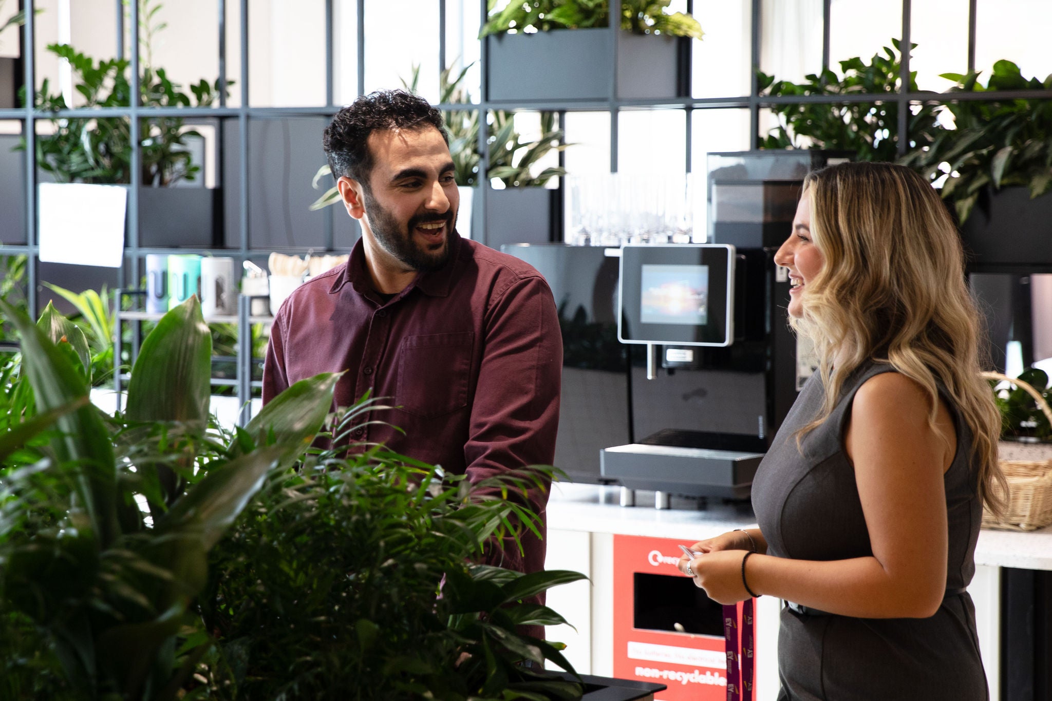 Two colleagues talking in the kitchen