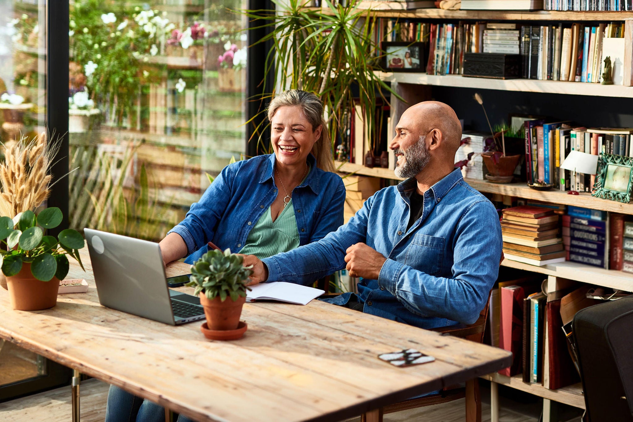 Mature couple using laptop, online shopping, agreement, e-commerce
