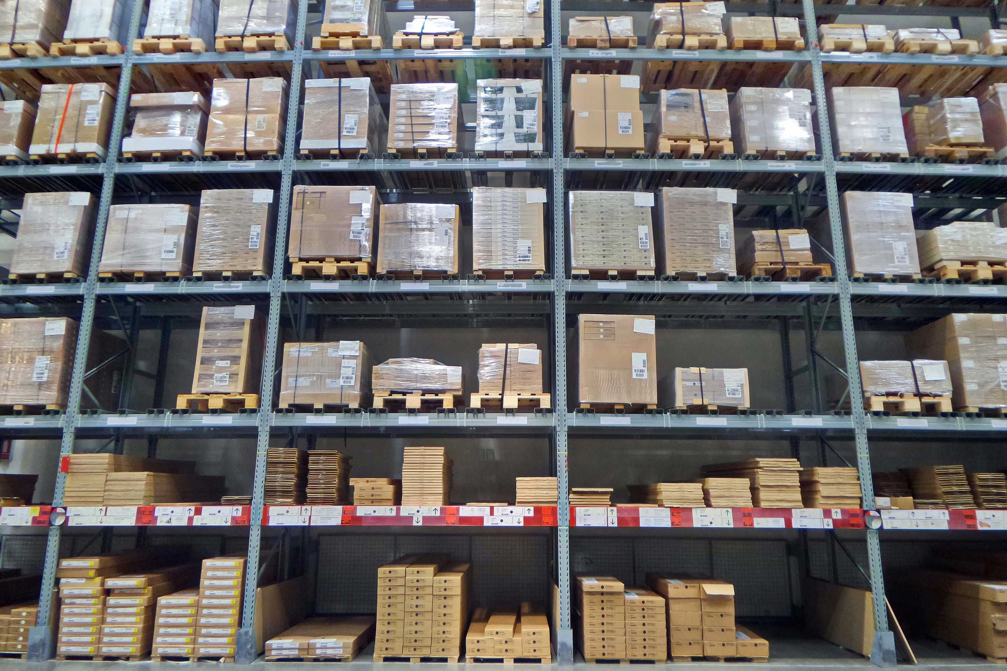 EY - Shipping warehouse with stacks of boxes