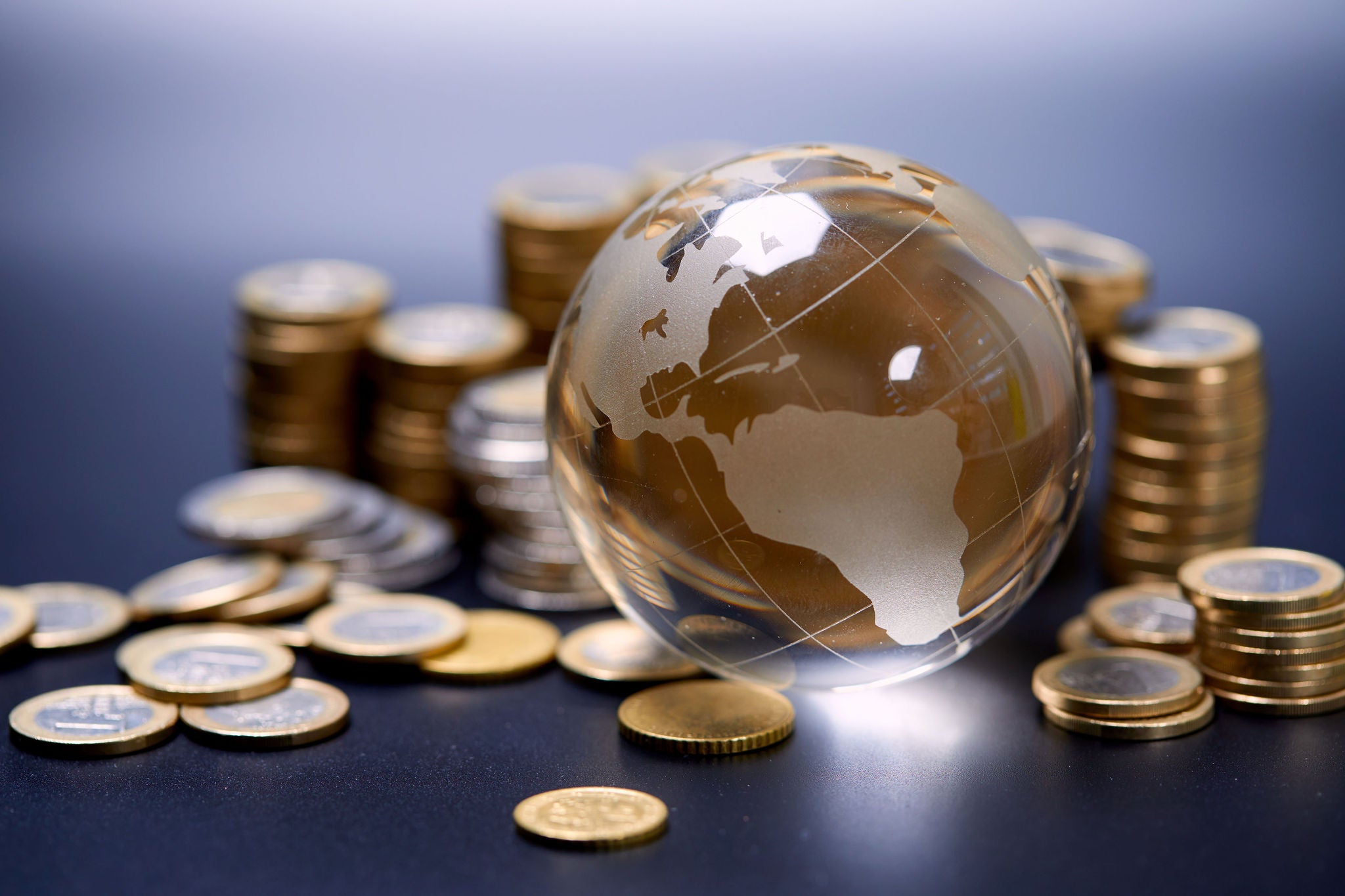 coins and glass globe