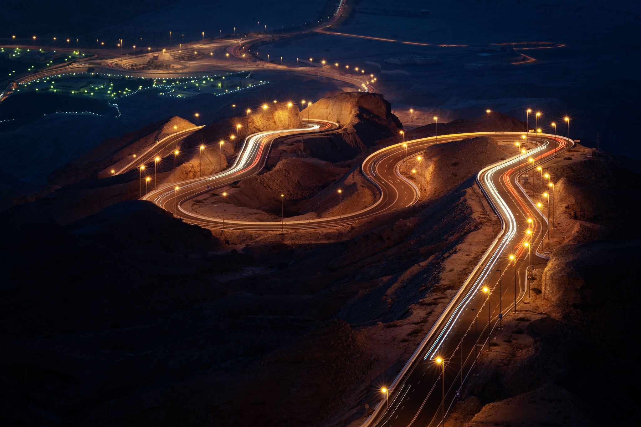 light trails of traffic on road at night