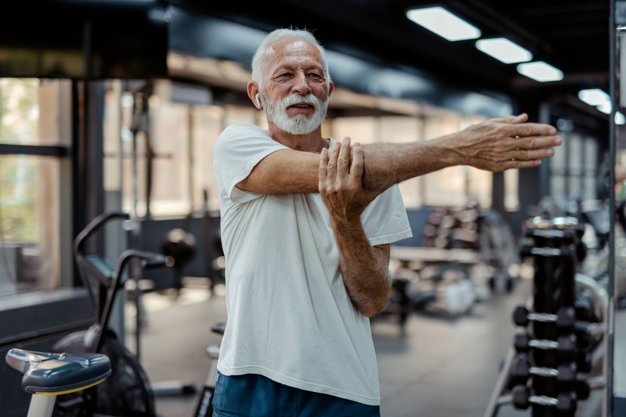 man stretching at gym