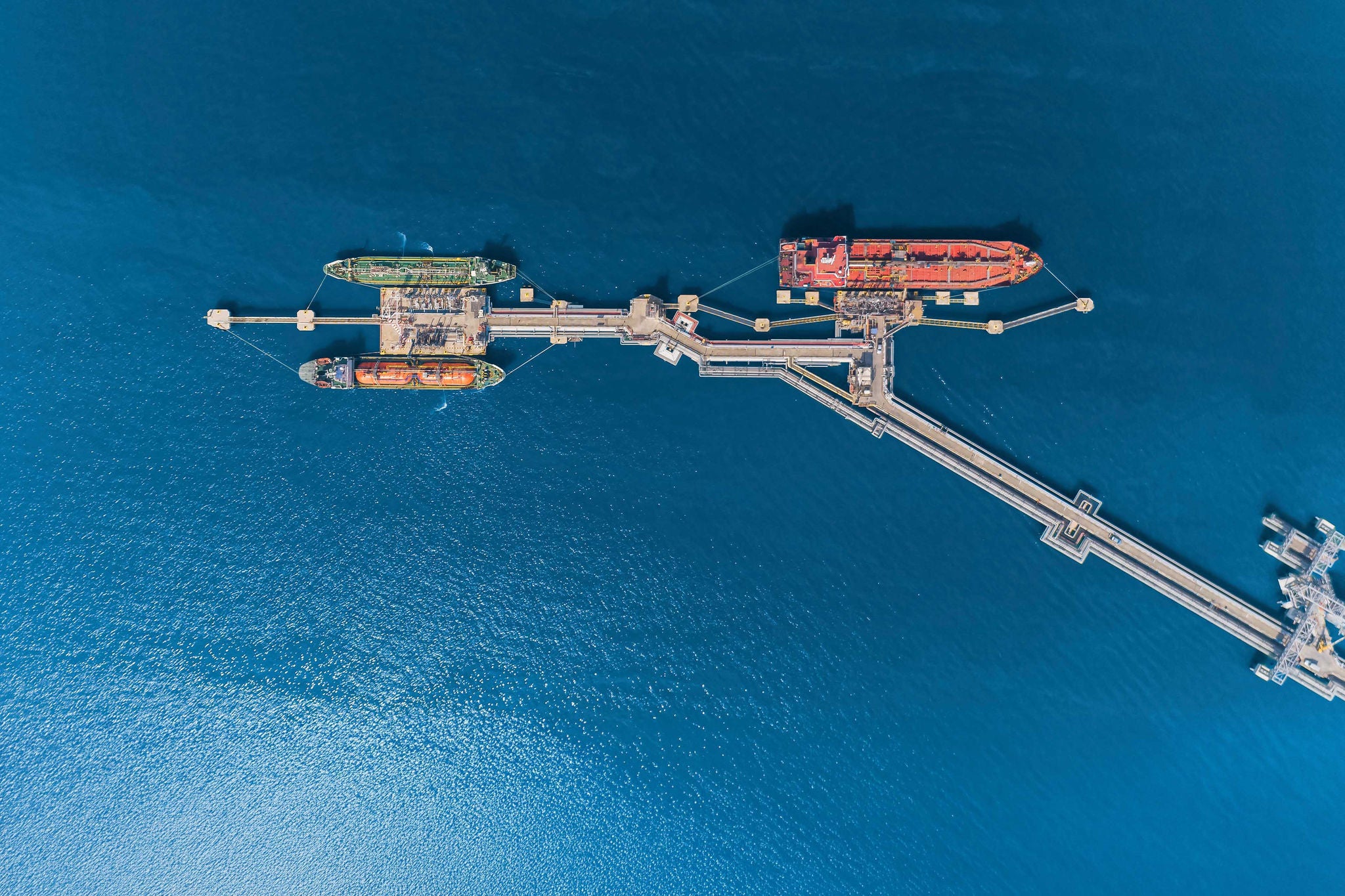 aerial top view oil tankers park at oil port.