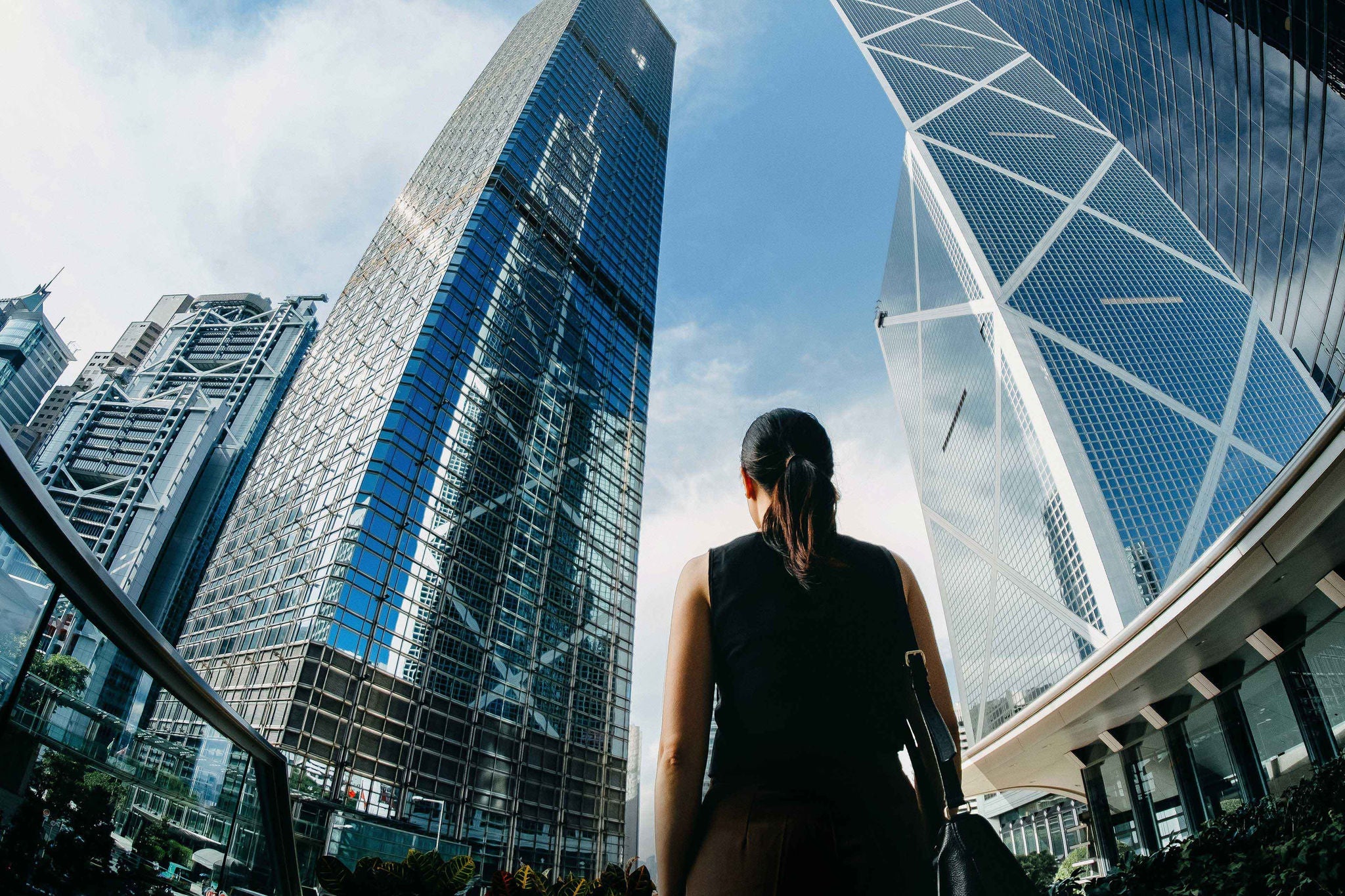 woman looking out to large buildings