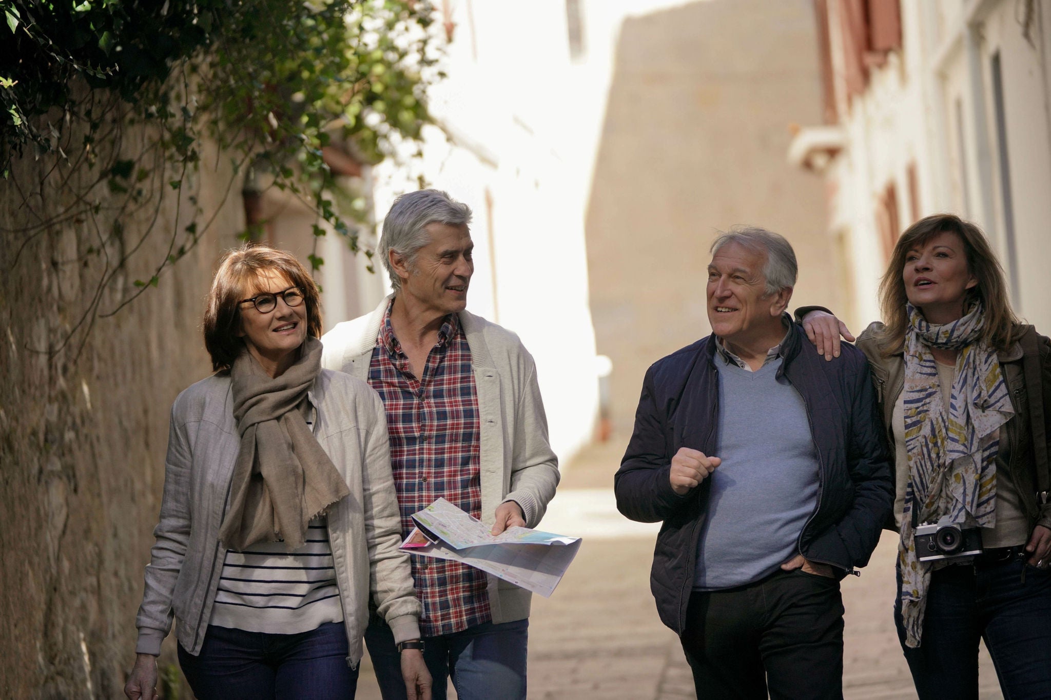 Tourists exploring a European-style street on a walking tour