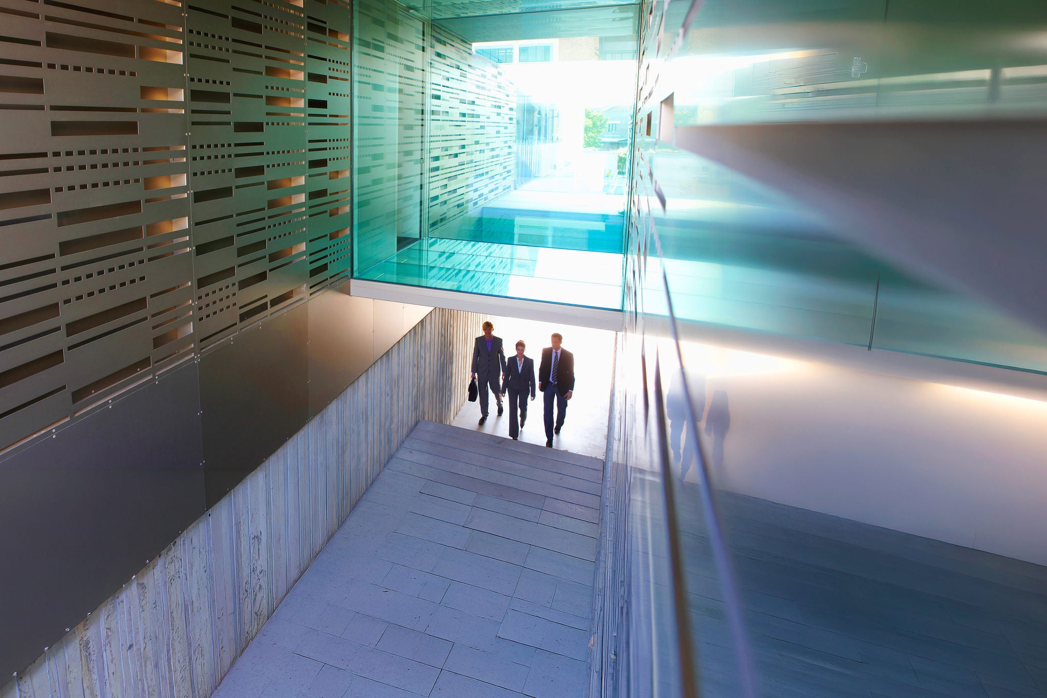 Business professionals walking through modern office