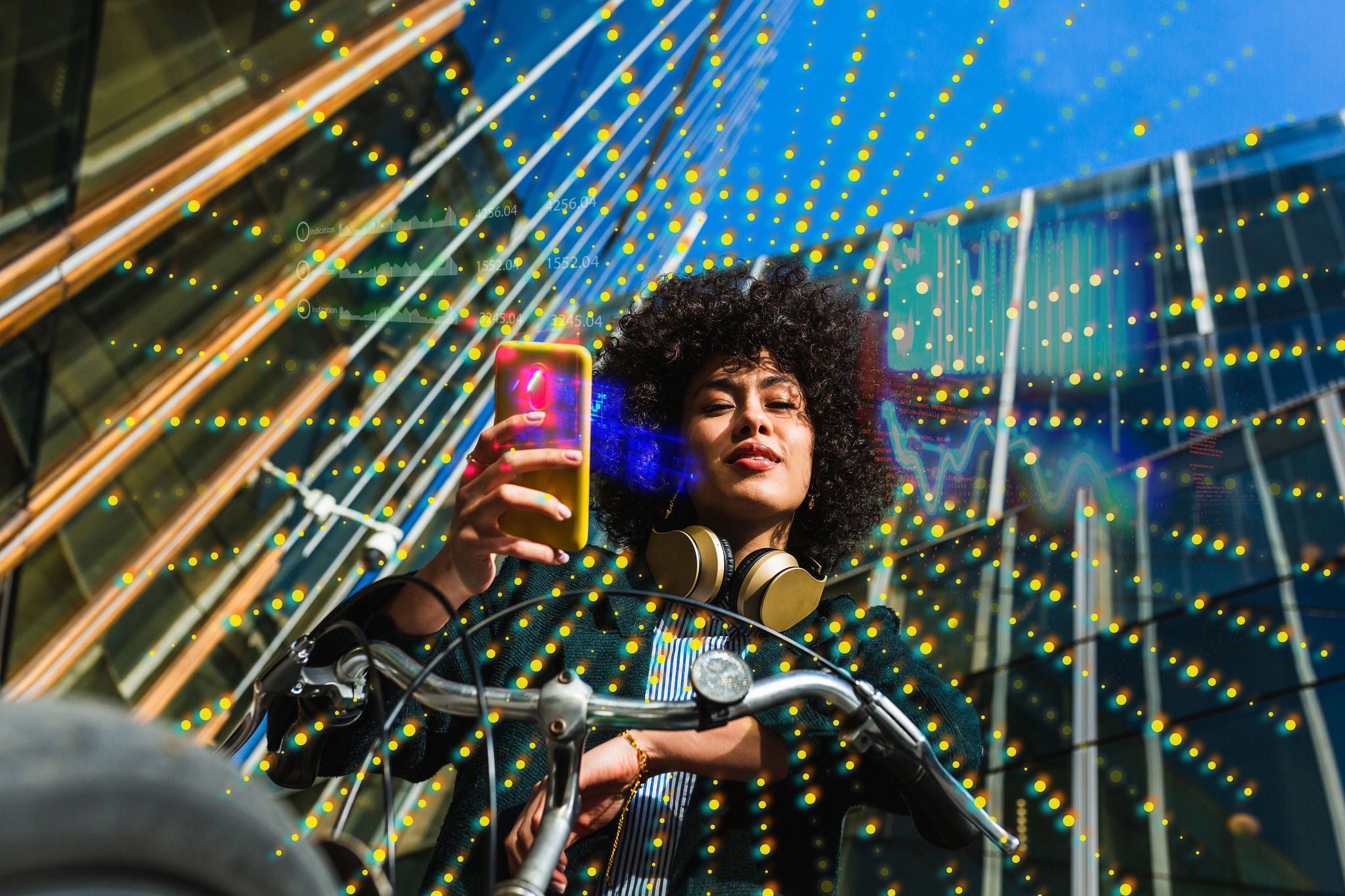 Low angle portrait of\ woman using a mobile and sitting