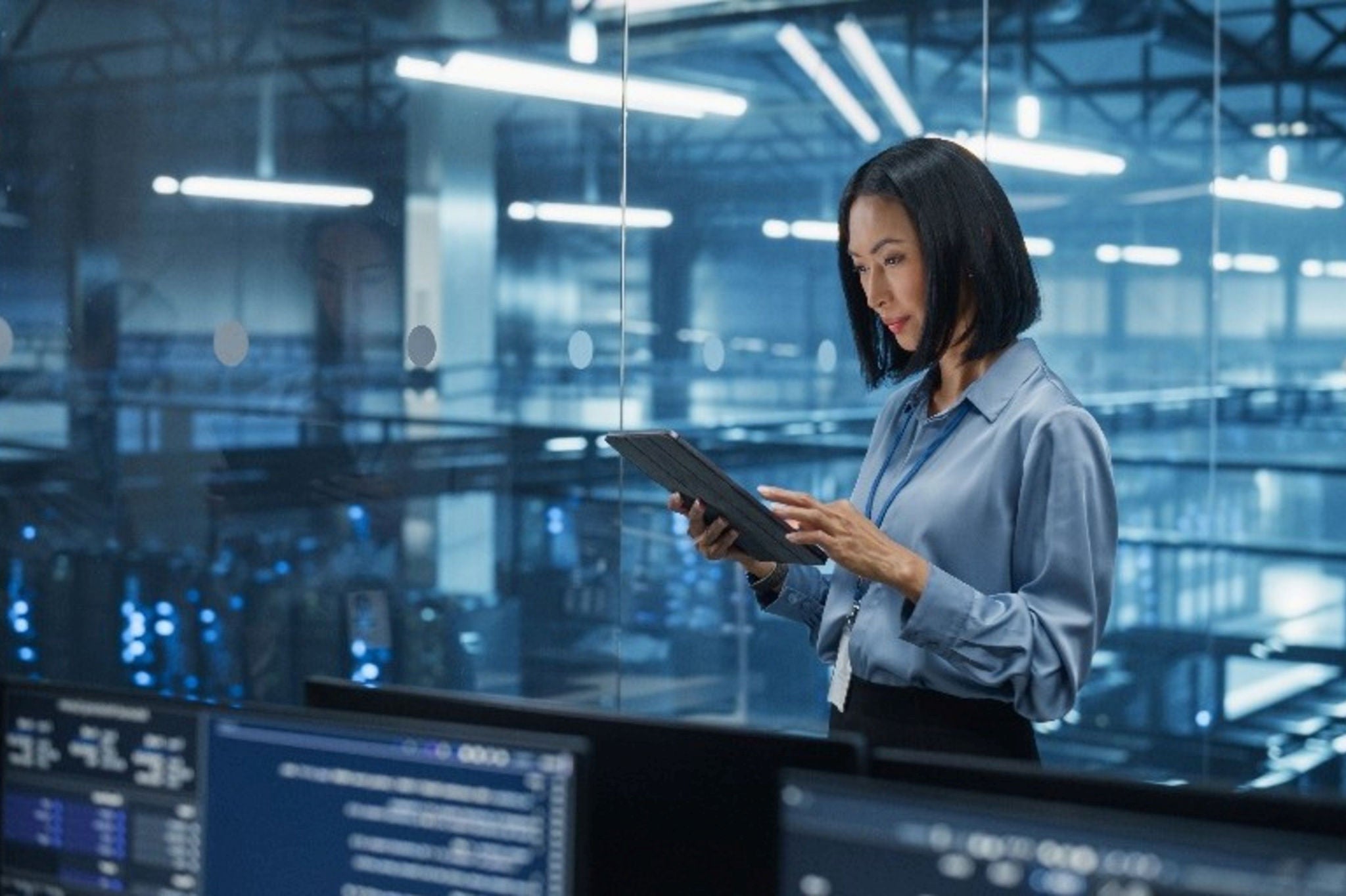Businesswoman inside an office using tablet