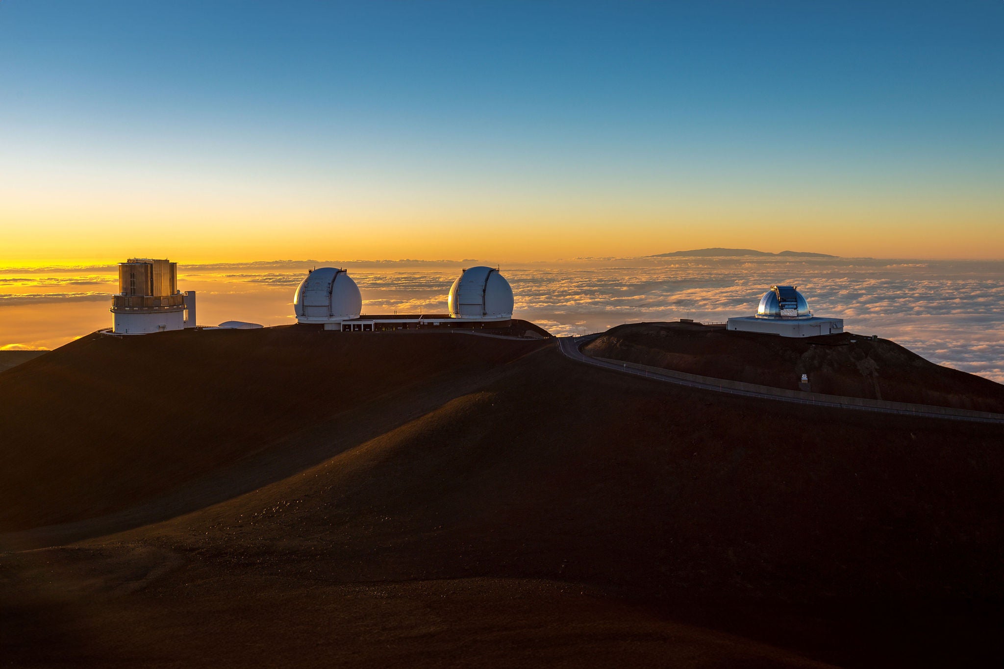 View on astronomic telescopes on Mauna Kea summit at sunset, Big Island, Hawaii