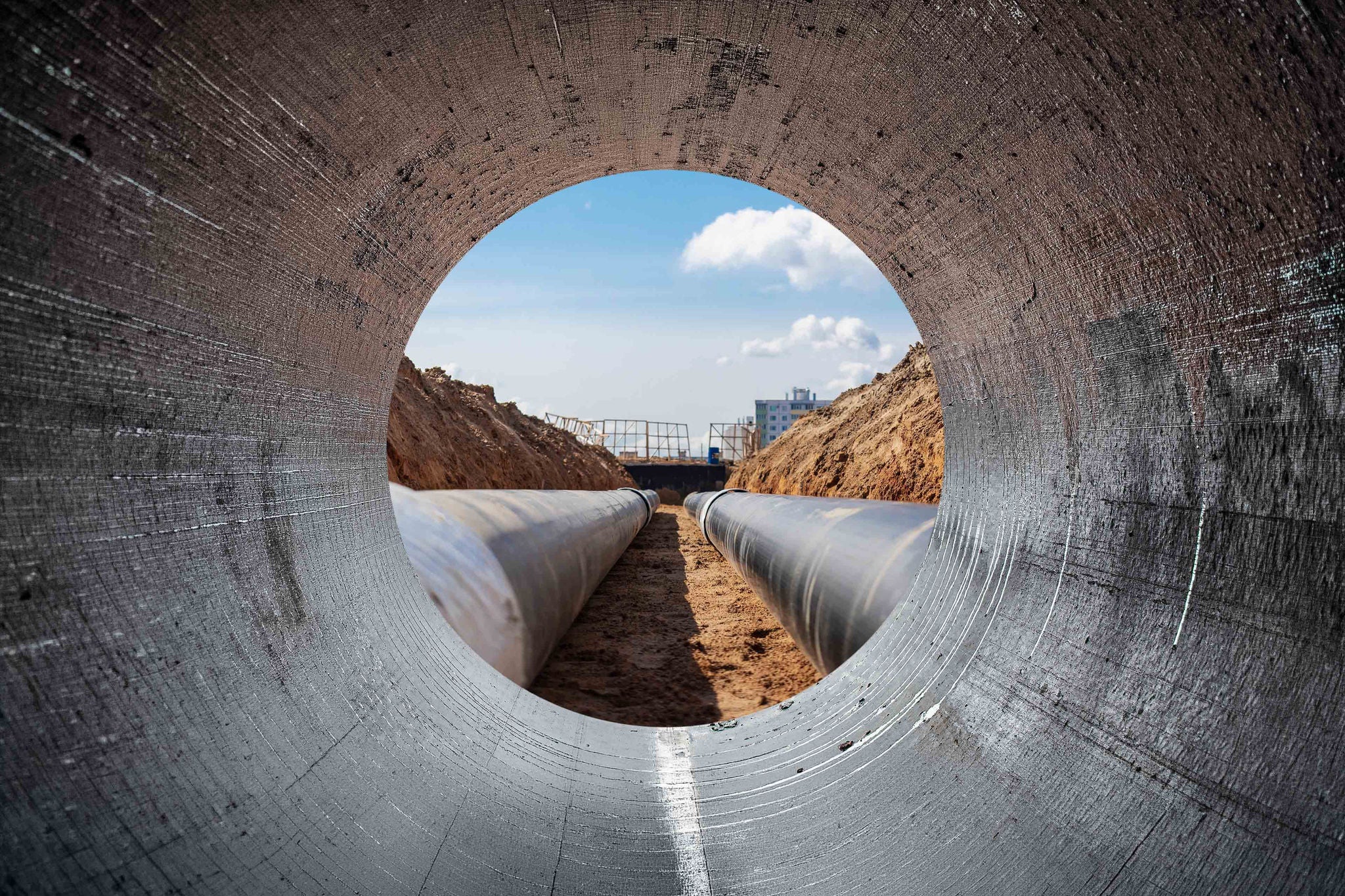Modern water supply and sewerage system. Close-up of underground utilities. View from the big pipe