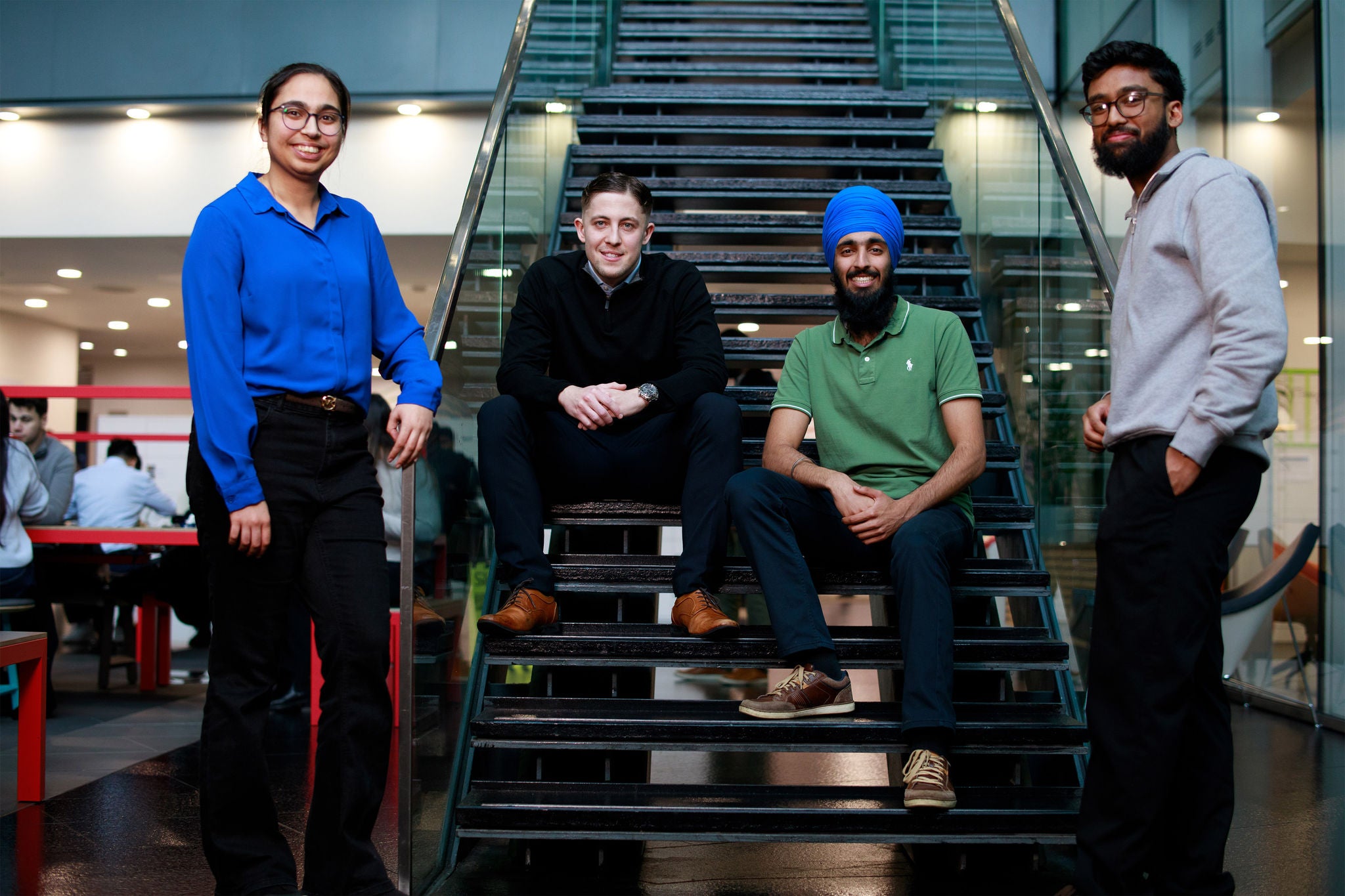 The four of them on the stairs