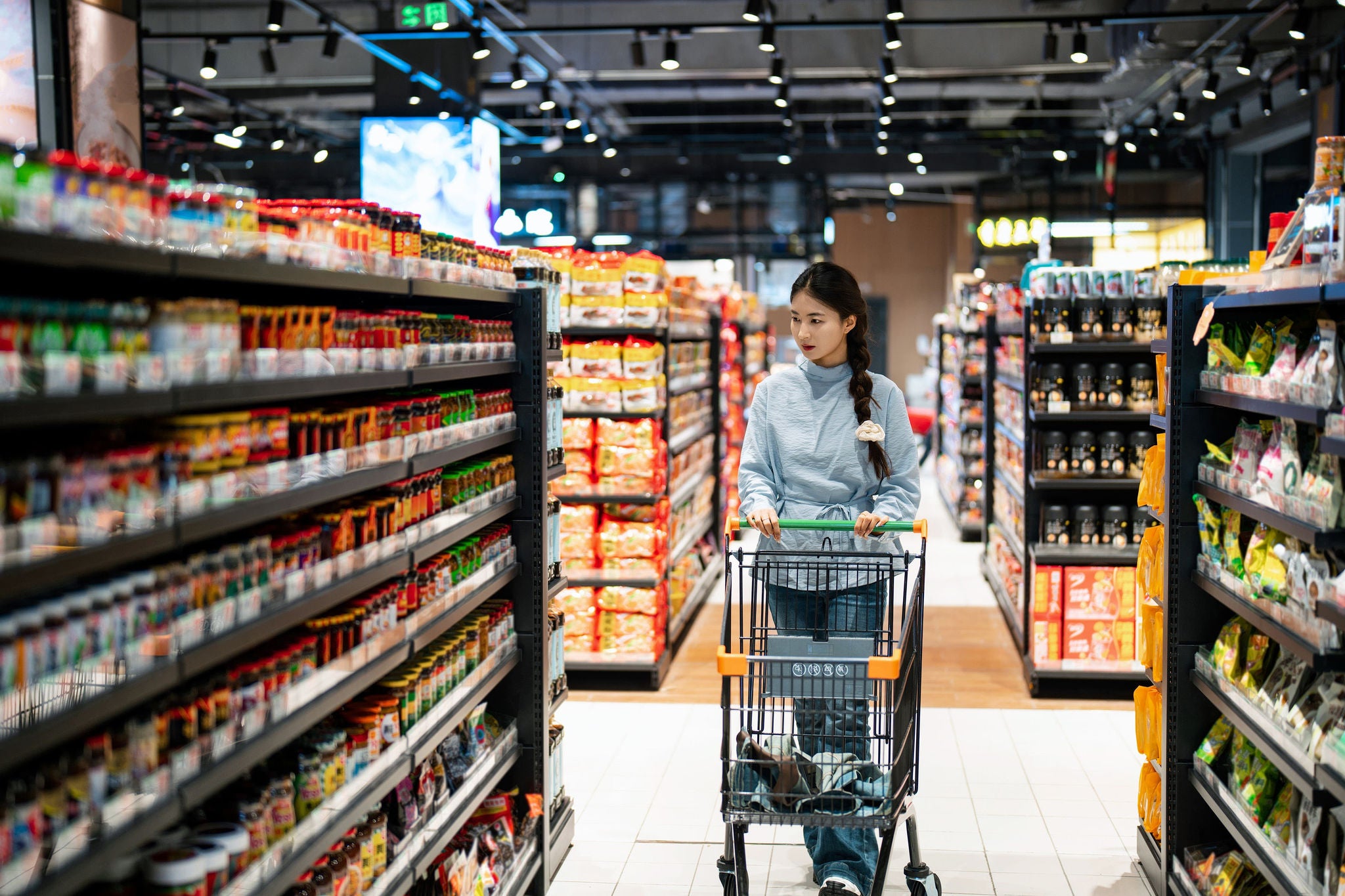 Asian young woman shopping in the supermarket