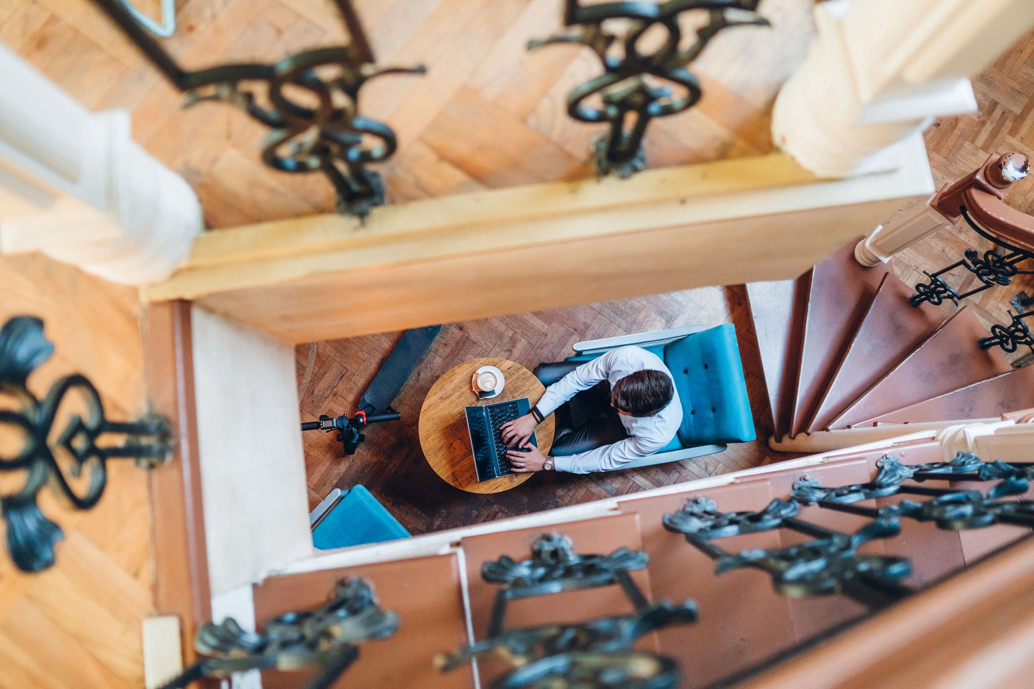 man-sitting-at-a-cafe