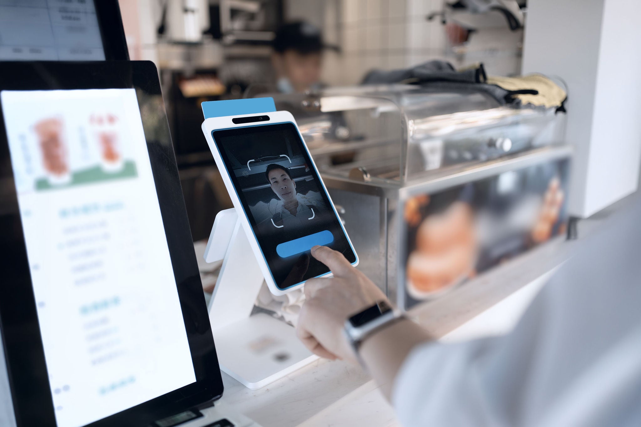 Asian man is using facial recognition for payment