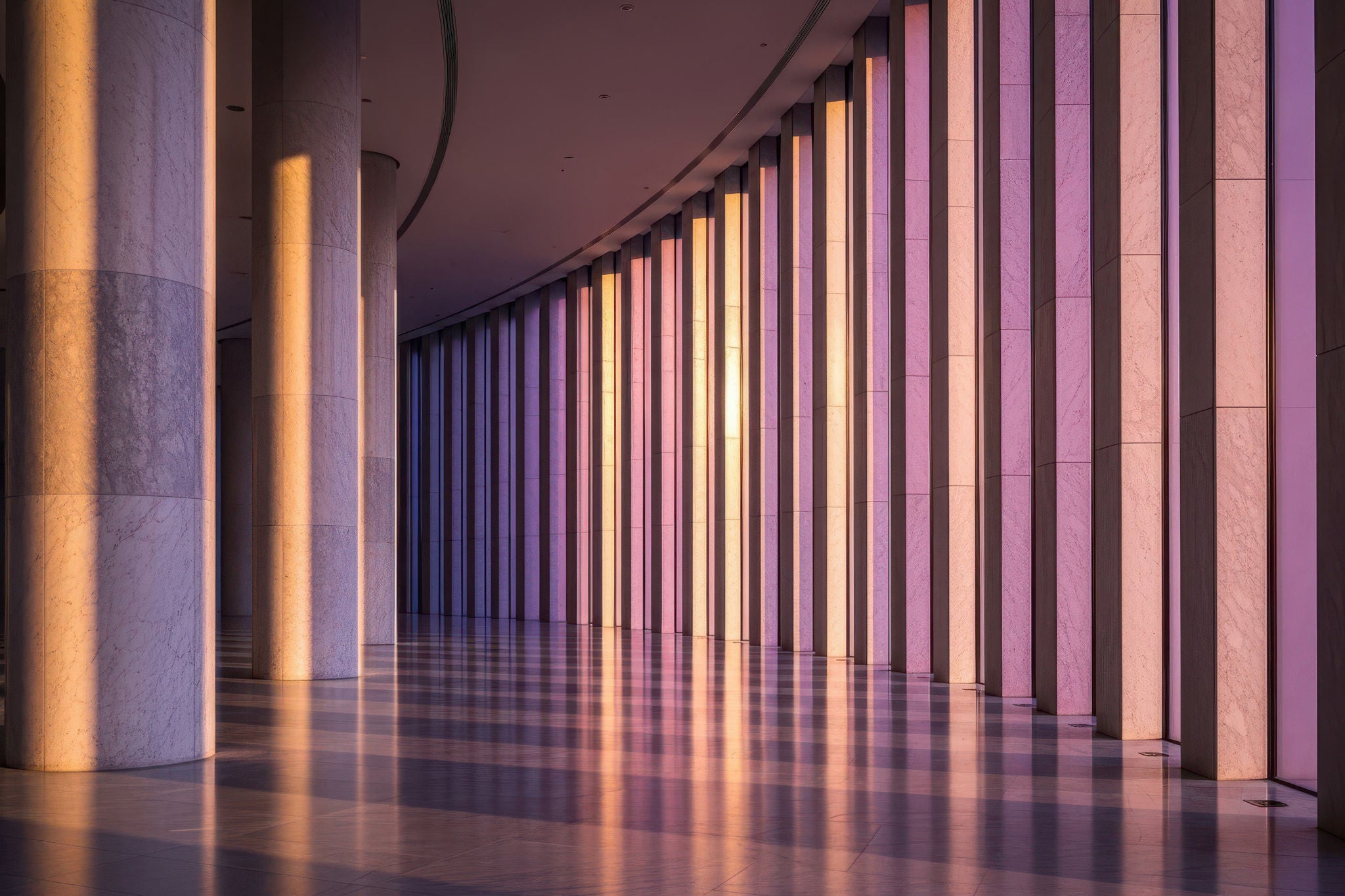 Man working on laptop while sitting in kitchen at home