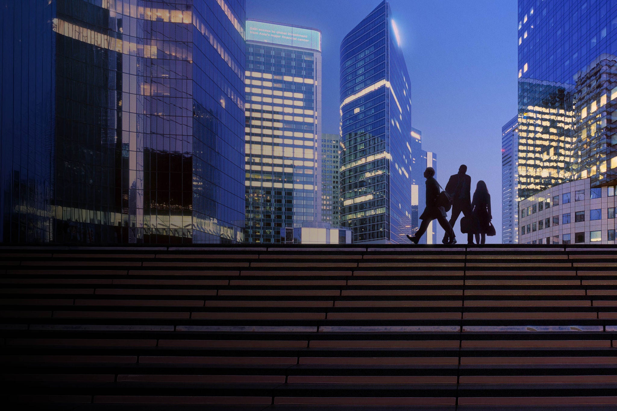 Morning image with businesswoman and businessmen arriving at modern business district.