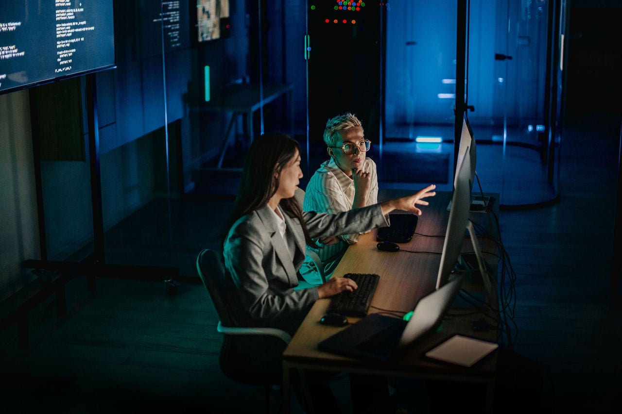 Team collaborates on data analysis in a modern data center