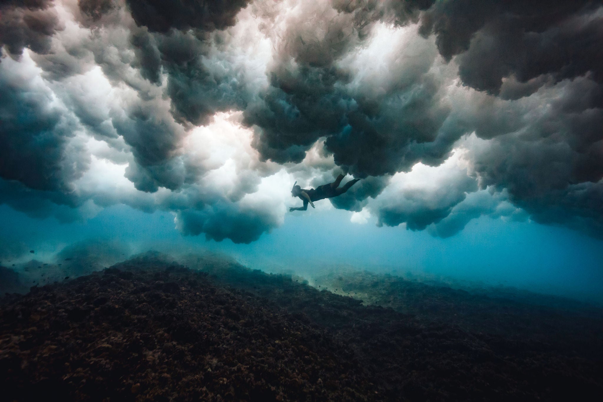 Underwater photography on location in the Indian ocean, surf adventure travel, Below the breaking waves, surf lifestyle ocean adventure.