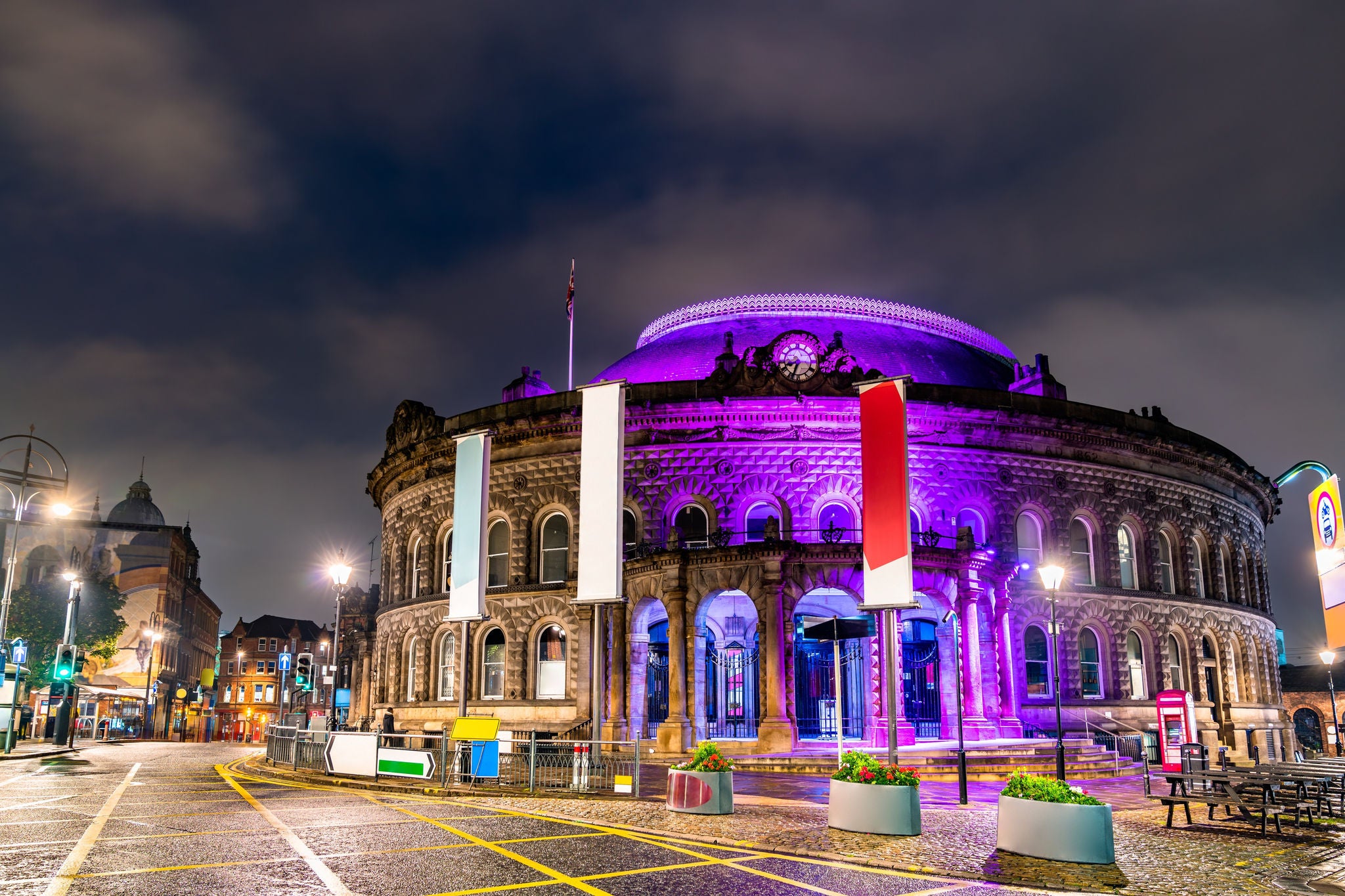 Historic circular building illuminated at night in city centre