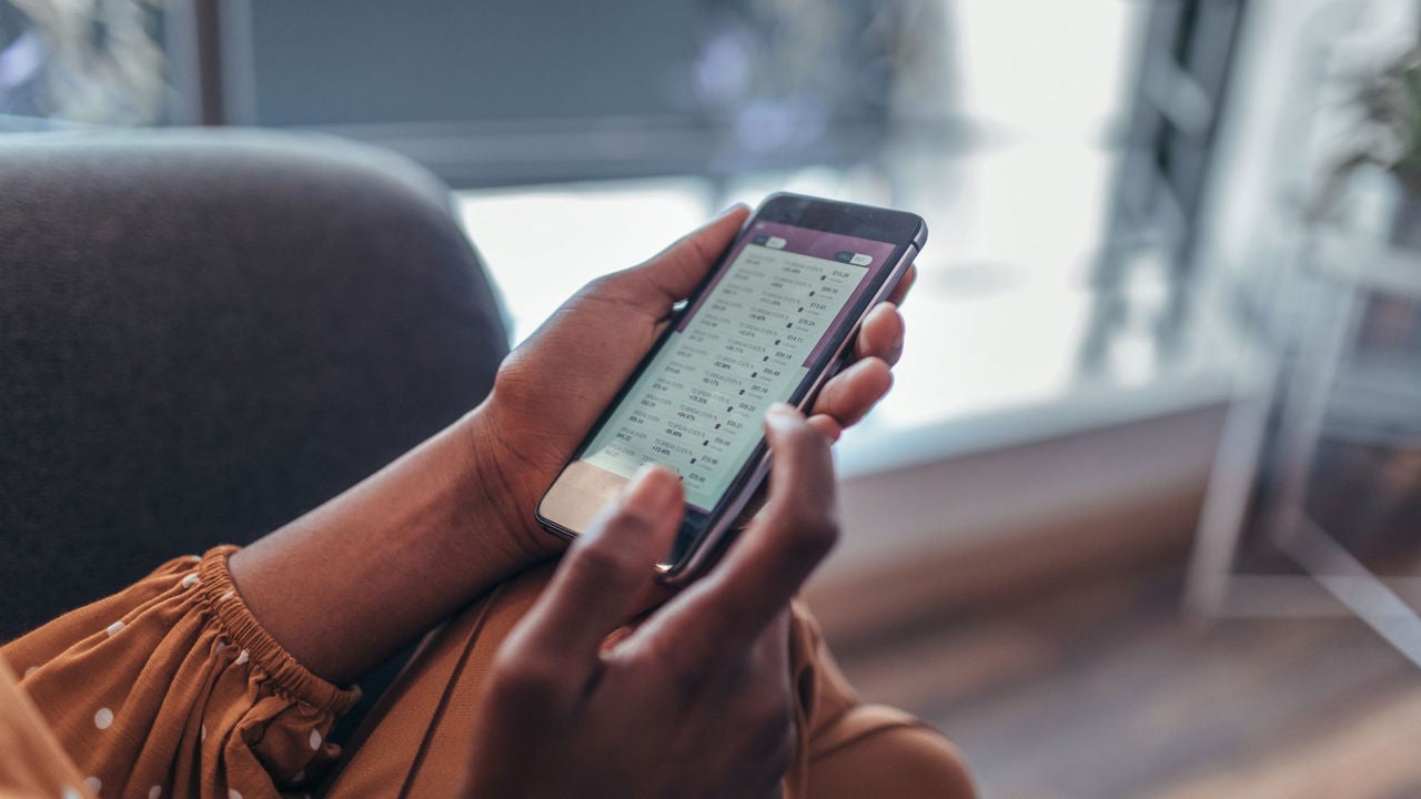 Close up of women's hands holding smartphone