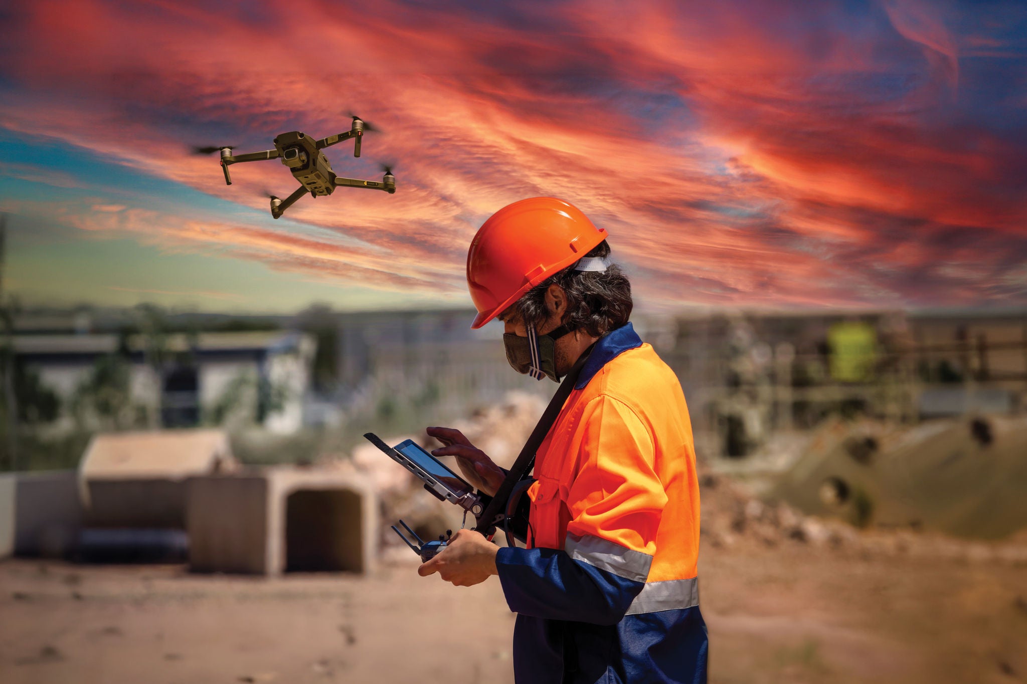 Worker operating a drone