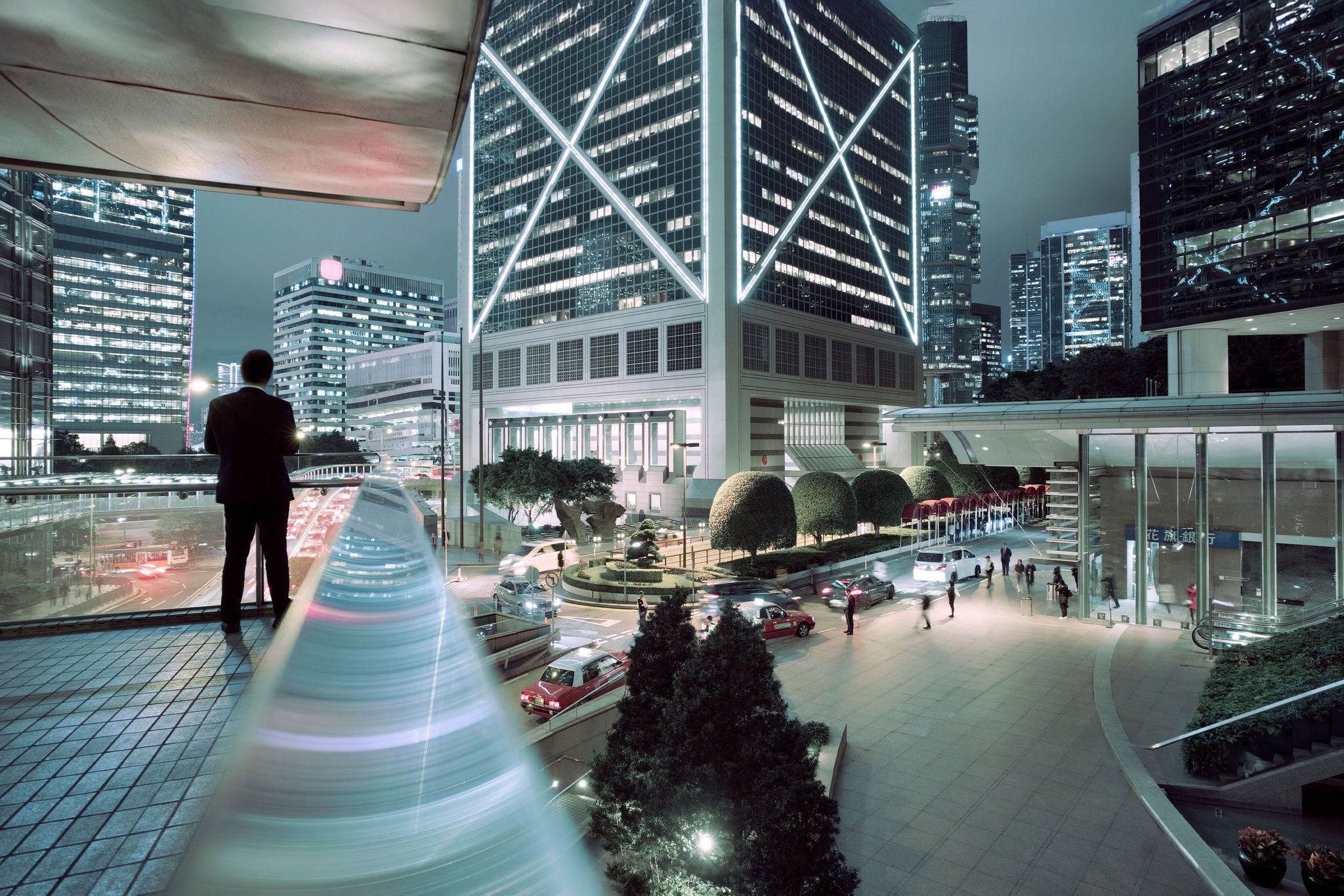 A man of European appearance writes down the task plans in a tablet