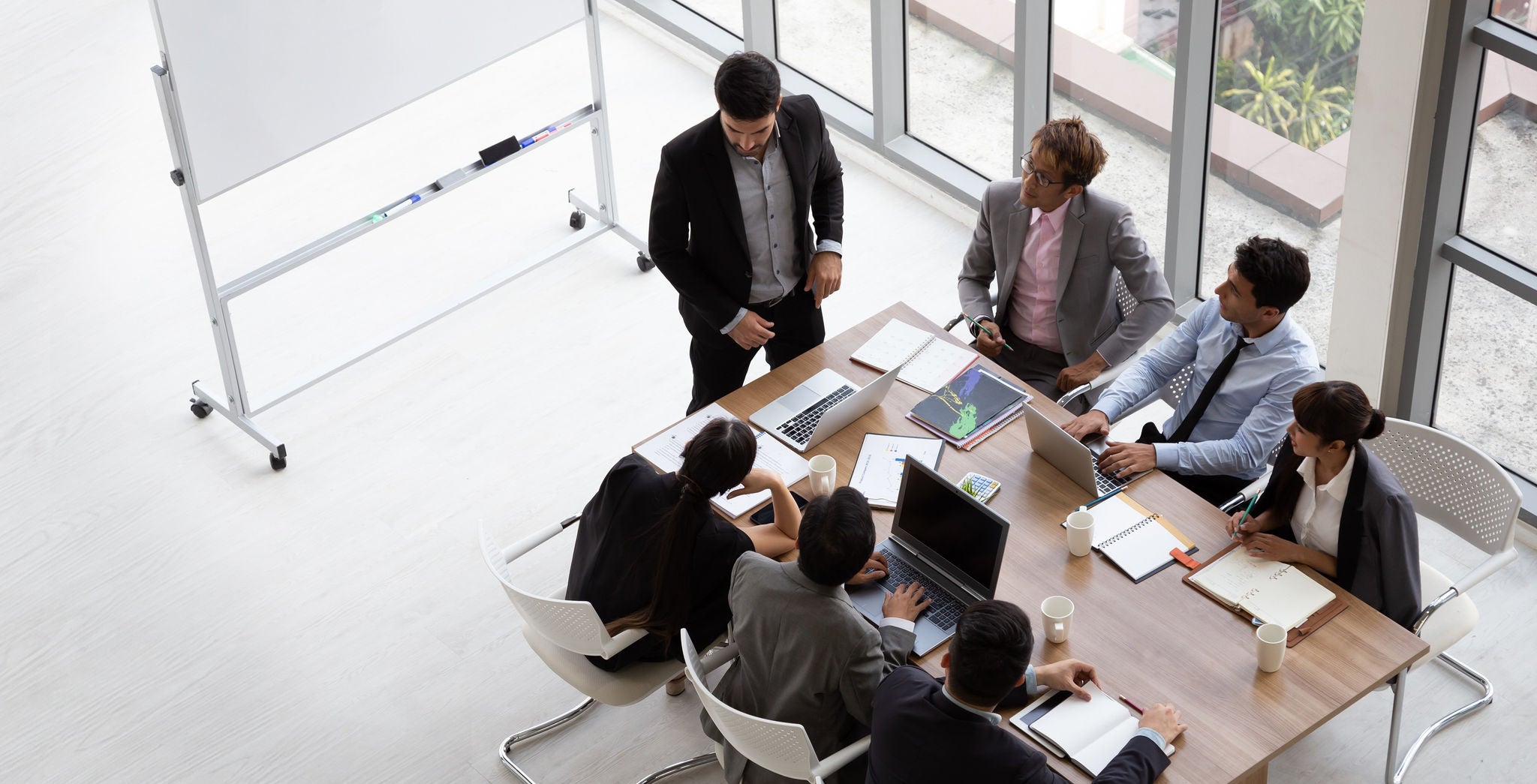 Corporate team meeting in modern office boardroom