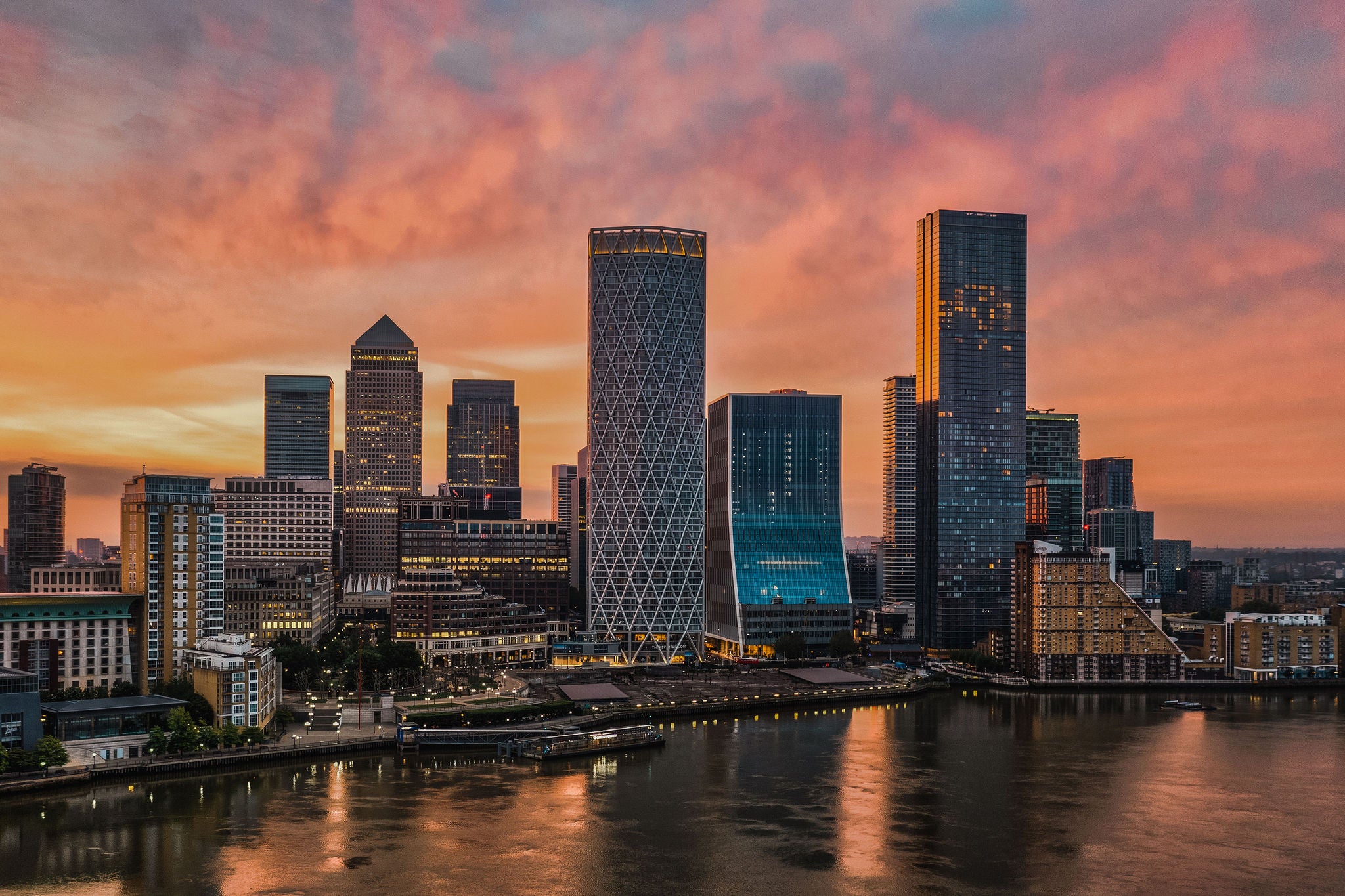 An elevated view of The Canary Wharf skyline, London at sunrise. Building between two tal towers is new headquarters of the European Bank for Reconstruction and Development (EBRD)